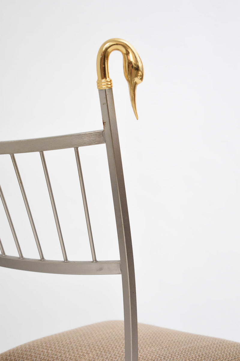 Pair of Swan Chairs — close-up of gold swan head detail