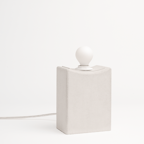 Reminder (001) – Table Lamp – Tall — close-up of textured concrete base