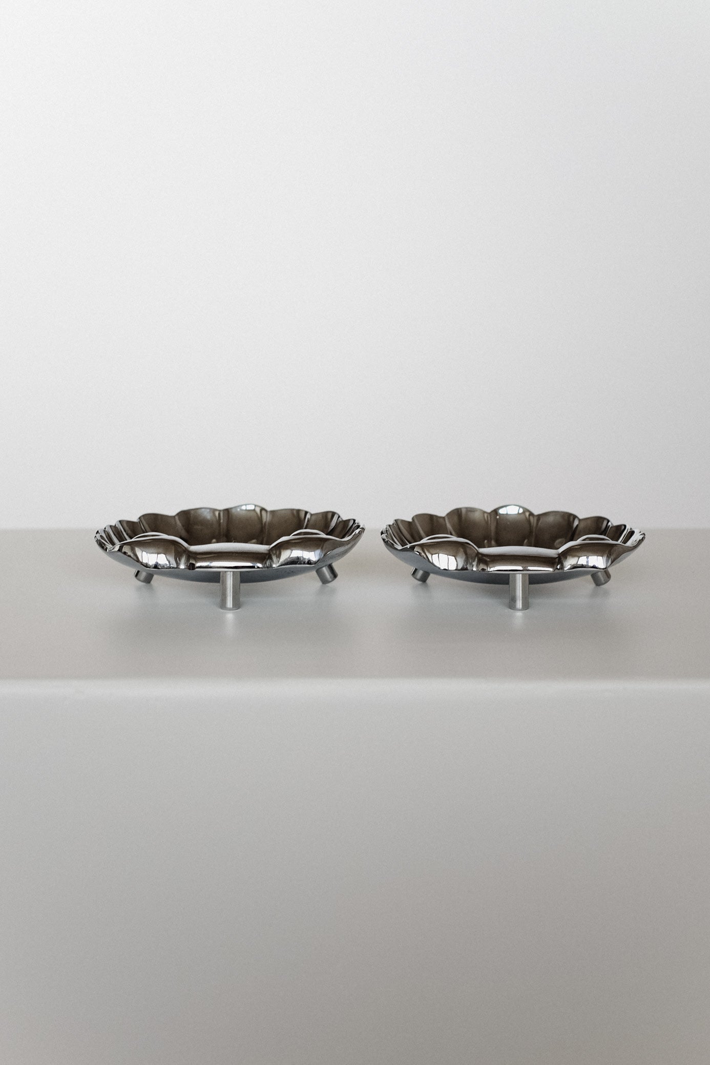 Set of 2 Shell Decorative Bowls — side angle on light surface