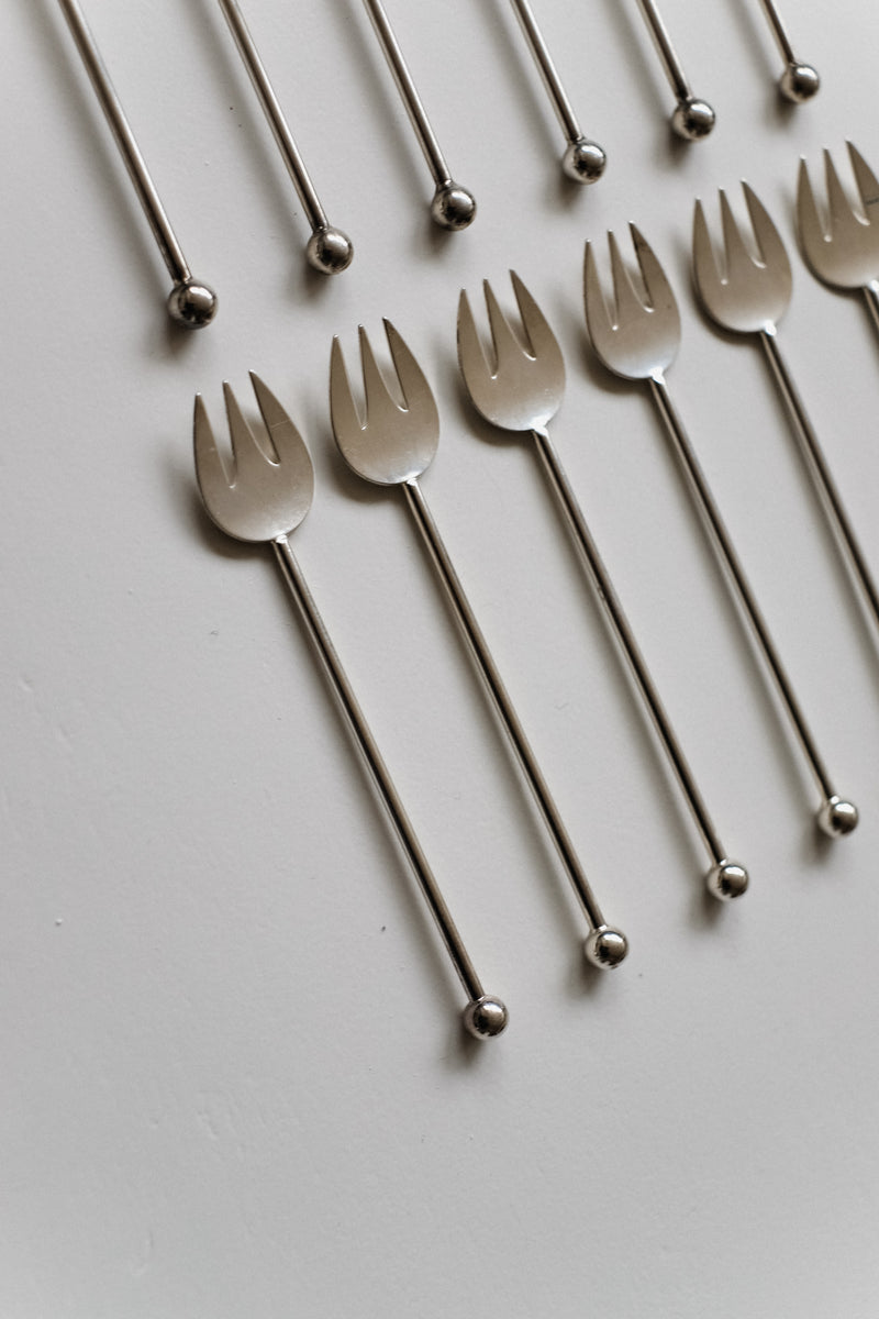 Silver-Plated Cutlery Set — close-up of fork tines on white background