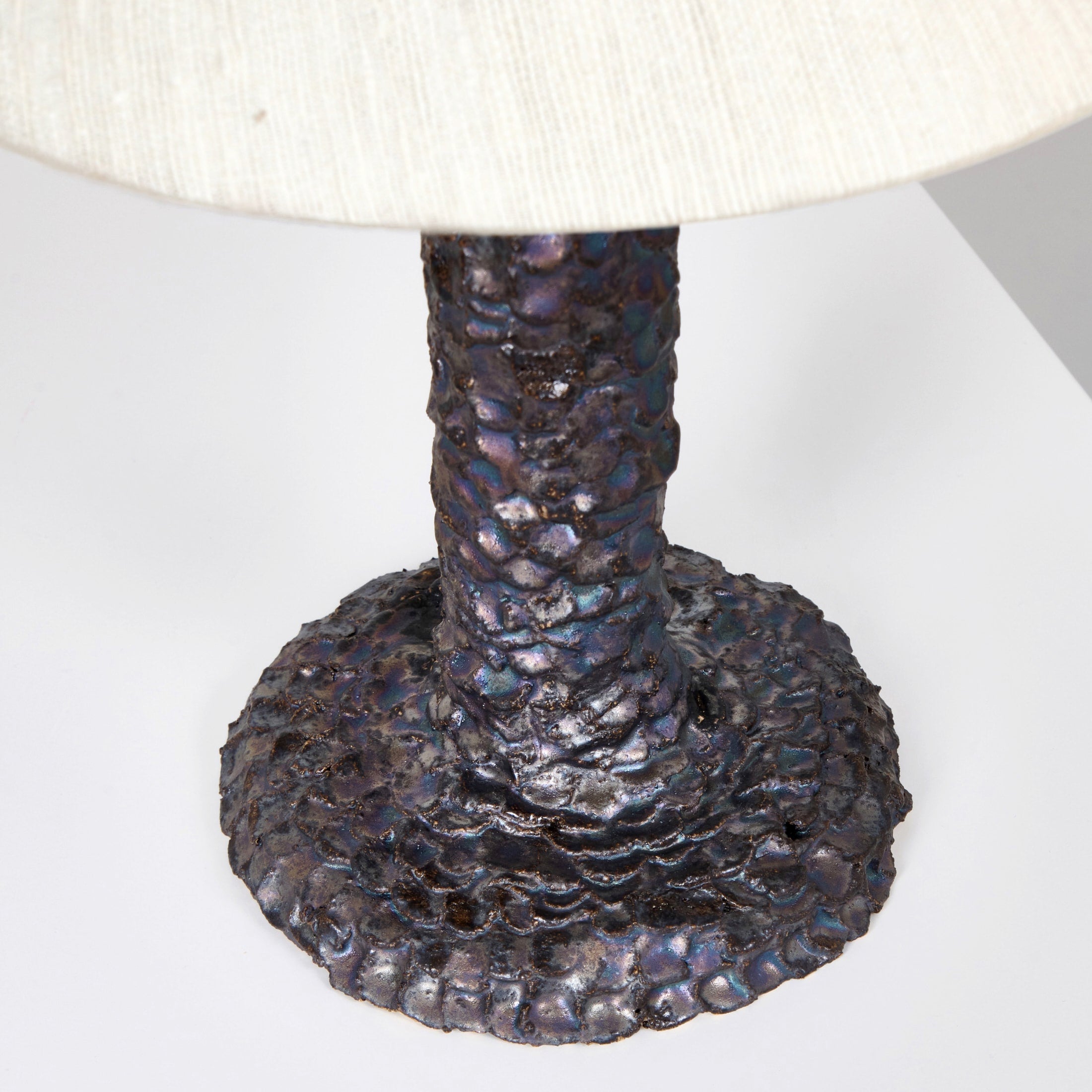 Casa Bedside Light — side angle showing textured metal base