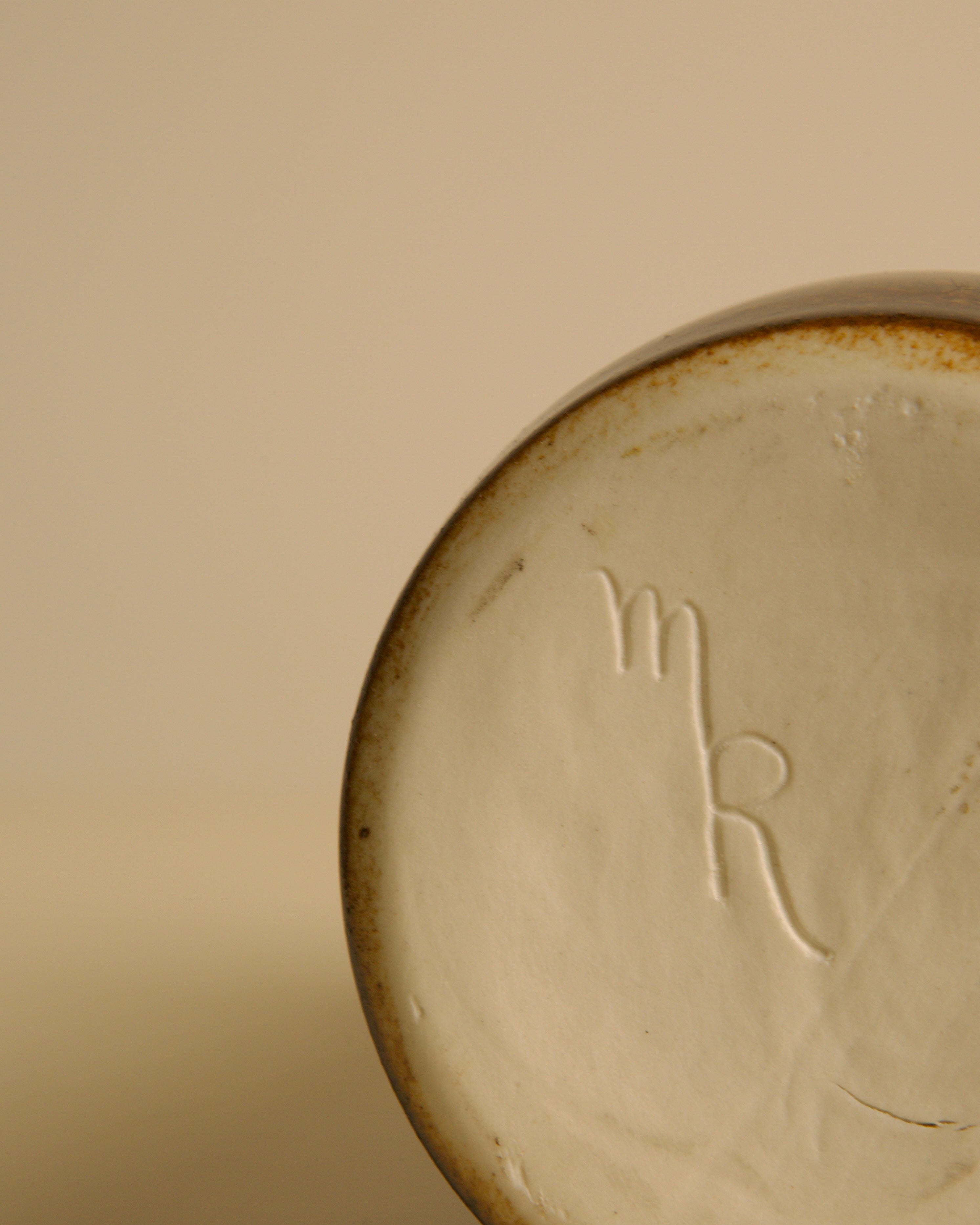 Bottom detail showing embossed maker's mark on vintage stoneware vase