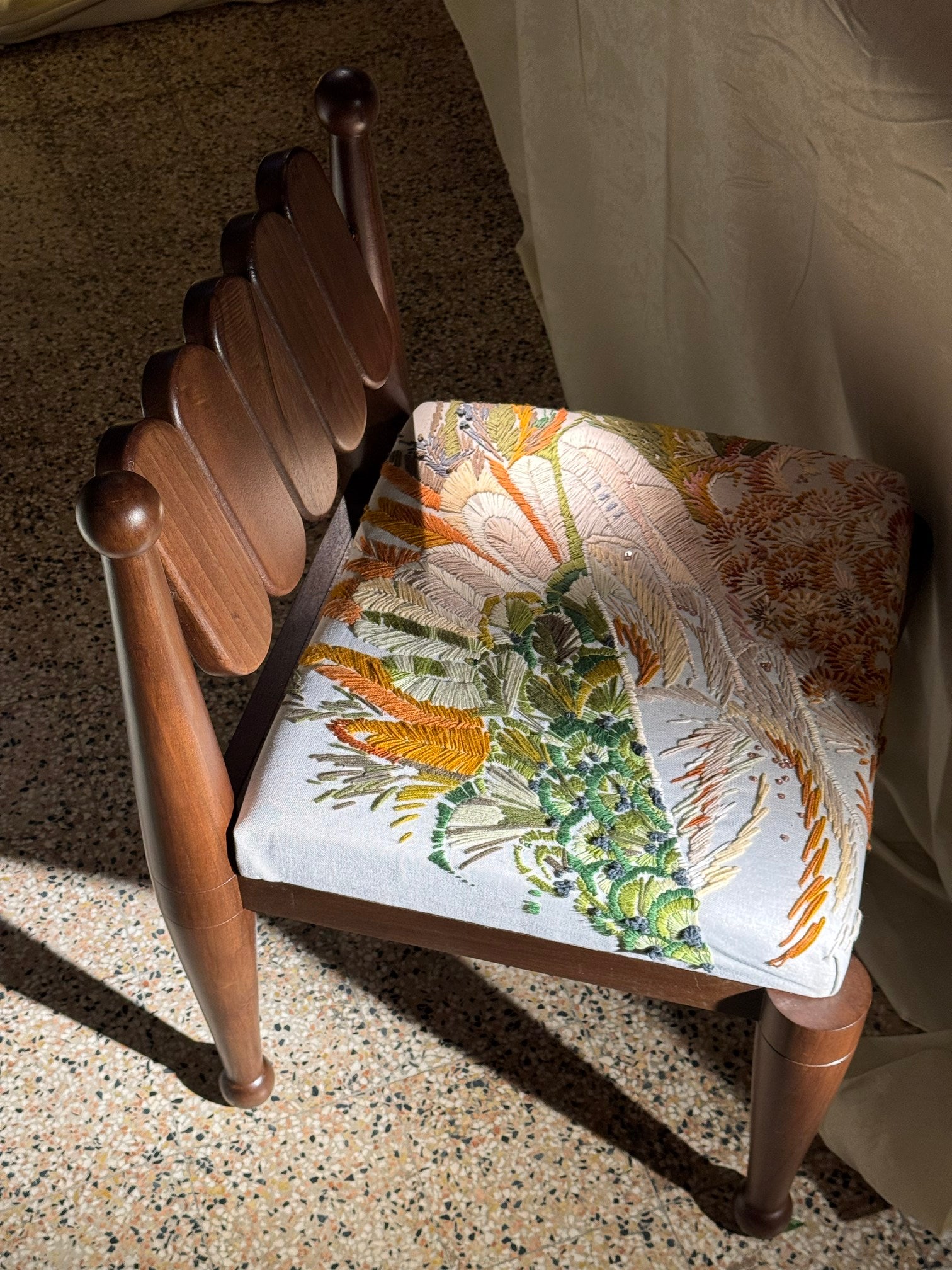 SIMORGH II – Solid Walnut with Hand-Embroidered Upholstery — angled view highlighting embroidered seat detail