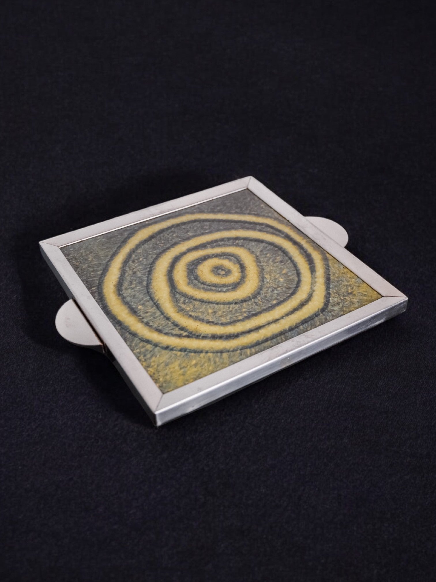 Space Age Spiral Ceramic Trivet, Spain, 1970's — angled view showing yellow spiral design
