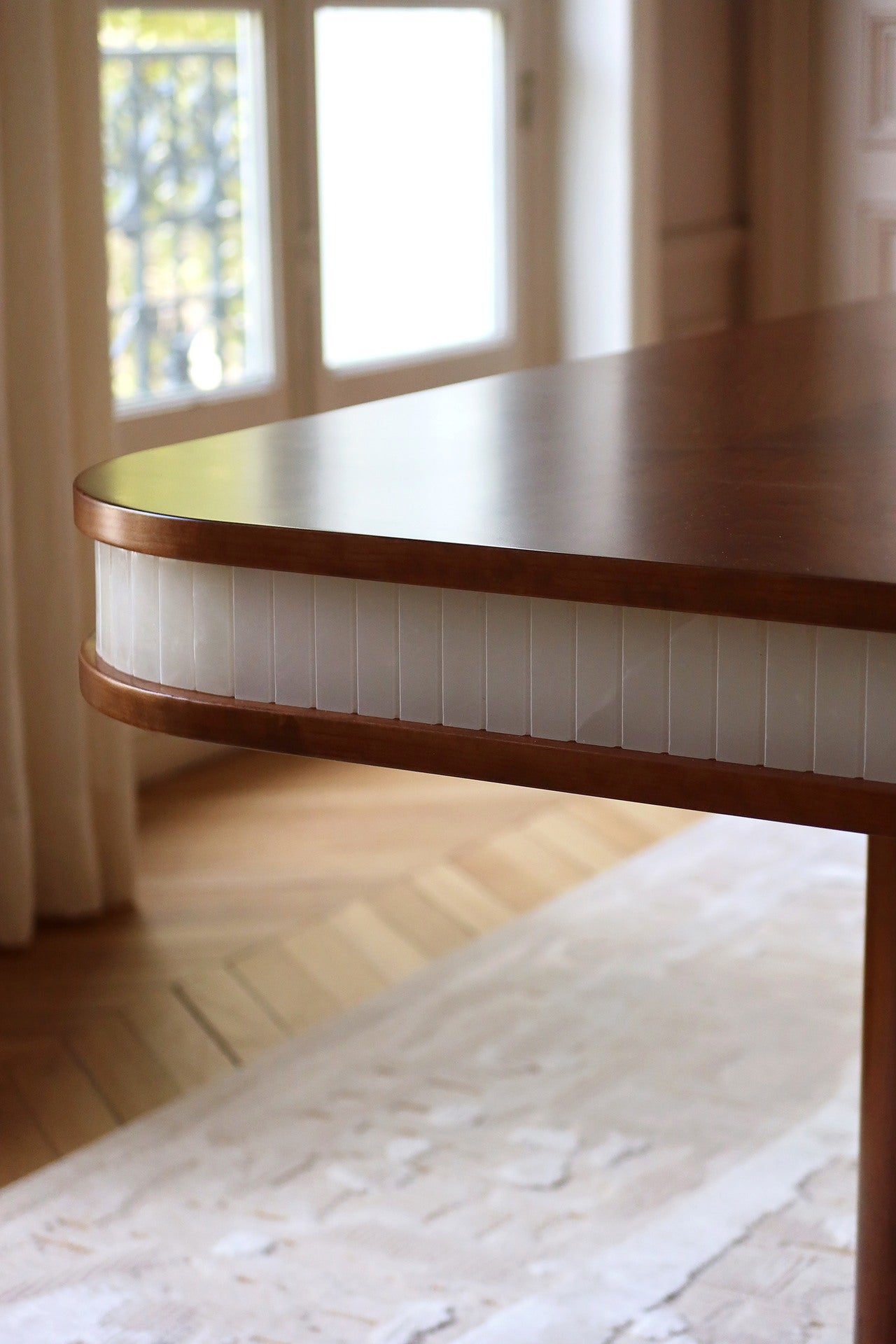 Doppio Wood And White Onyx Dining Table — close-up of onyx and wood detail