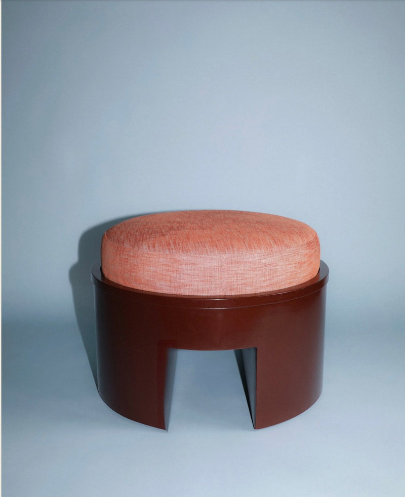 Roan upholstered ottoman with coral fabric and walnut base
