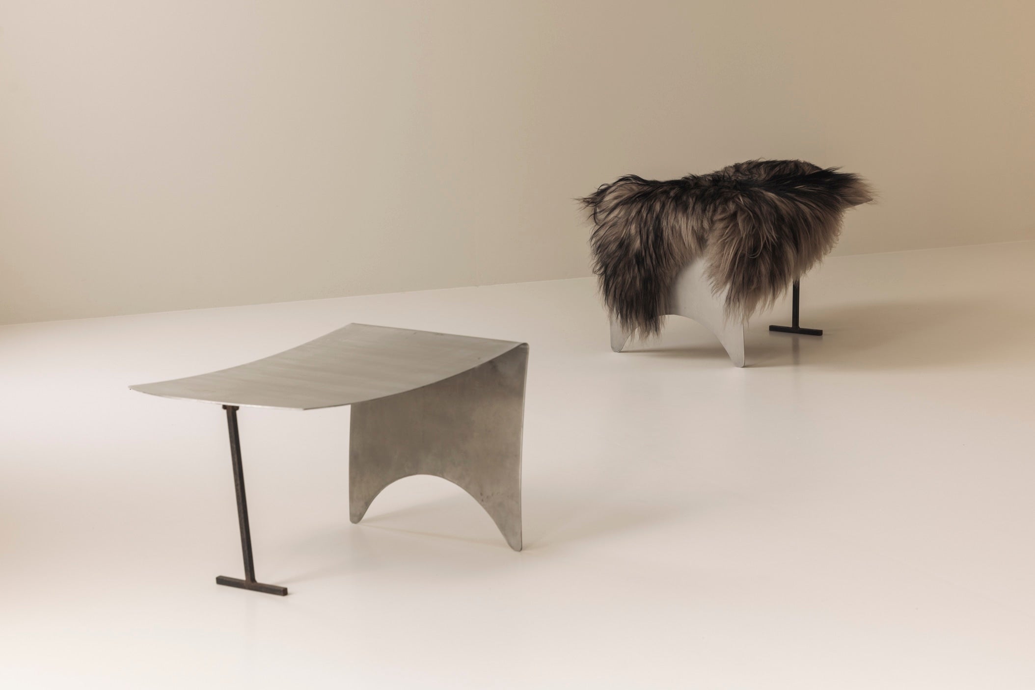 A striking set Modernist curved metal stools from France, dating to the 1980s. — lifestyle setting