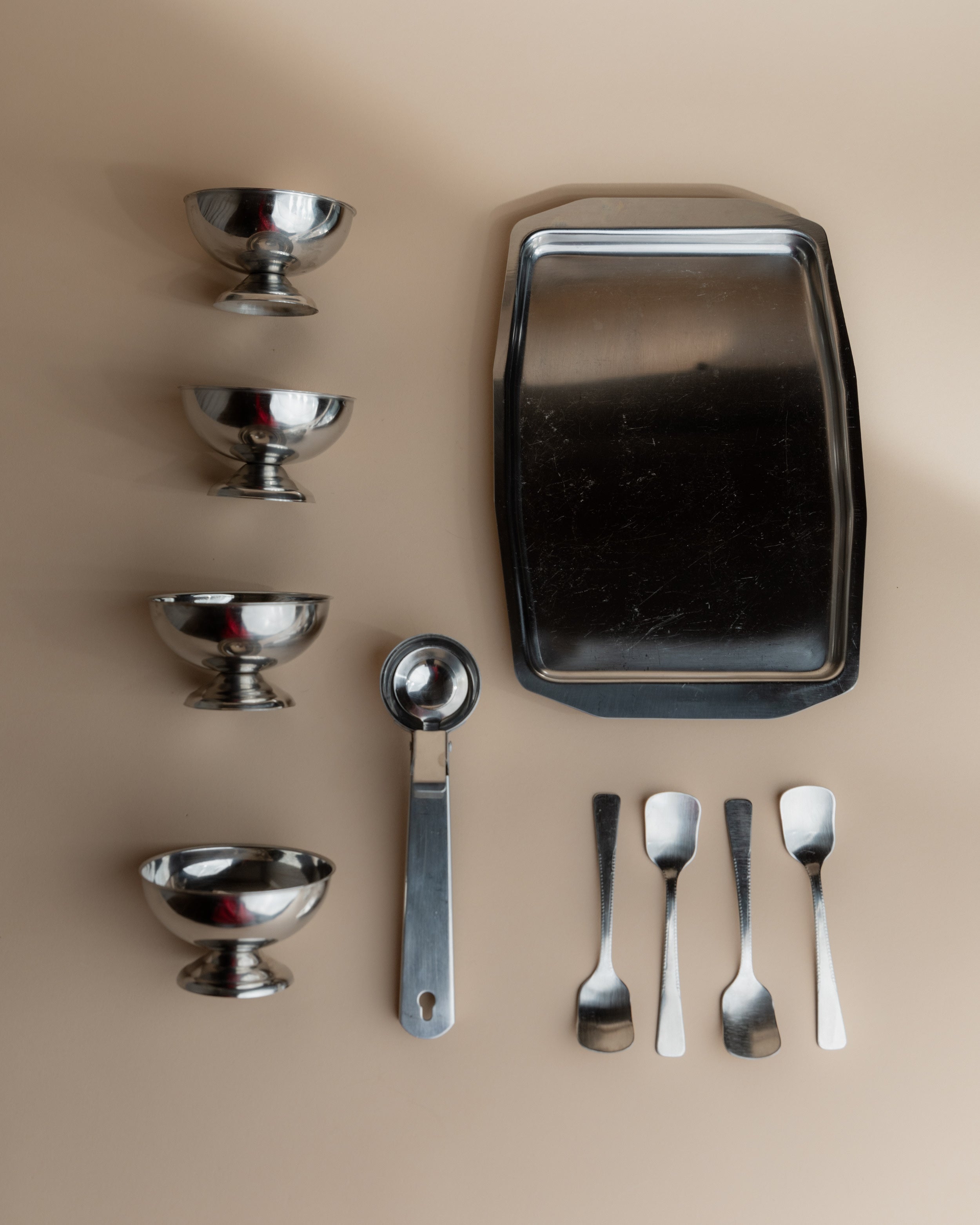 Vintage 1970s Ice Cream Serving Set for 4, Stainless Steel Cups, Spoons, Tray, Scoop — top view of stainless steel cups and t