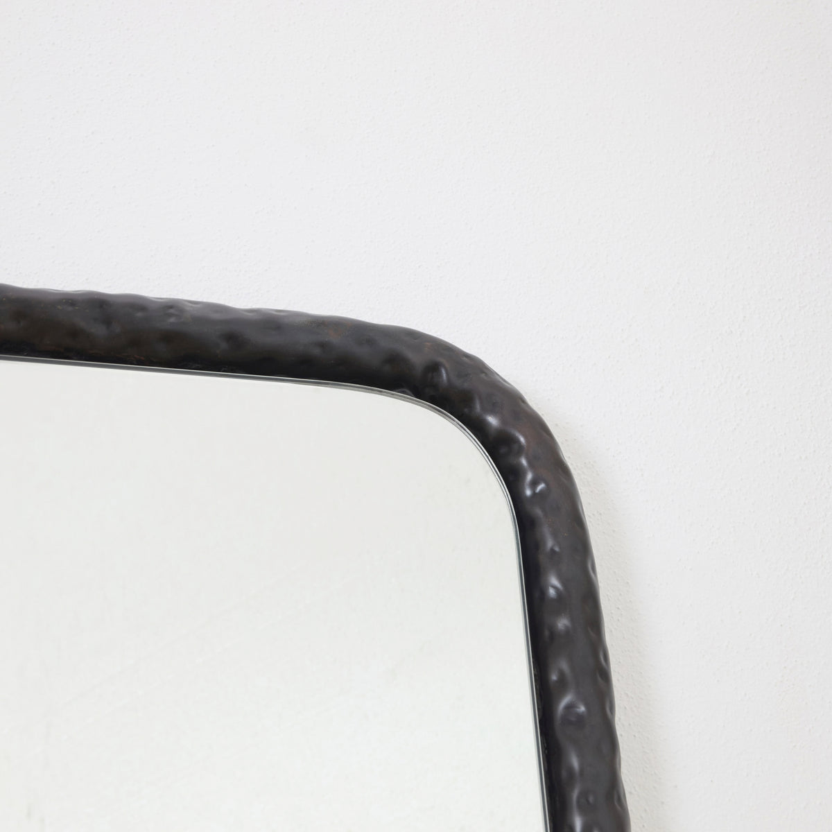 Serrallés - hammered metal mirror — side angle