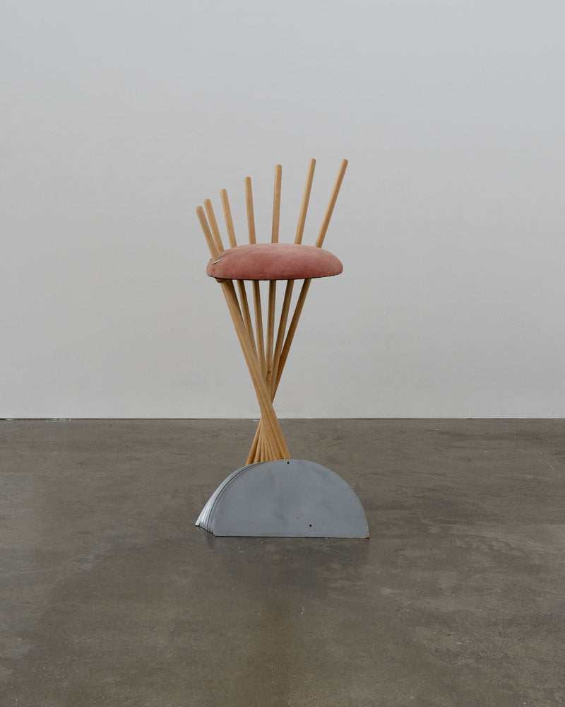 Postmodern prototype stool with curved wooden dowels and pink seat