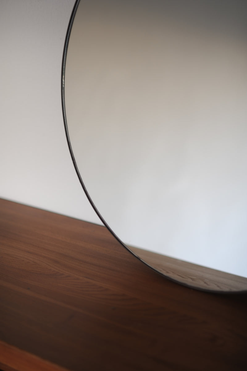 Close-up detail of Italian mid-century circular mirror edge
