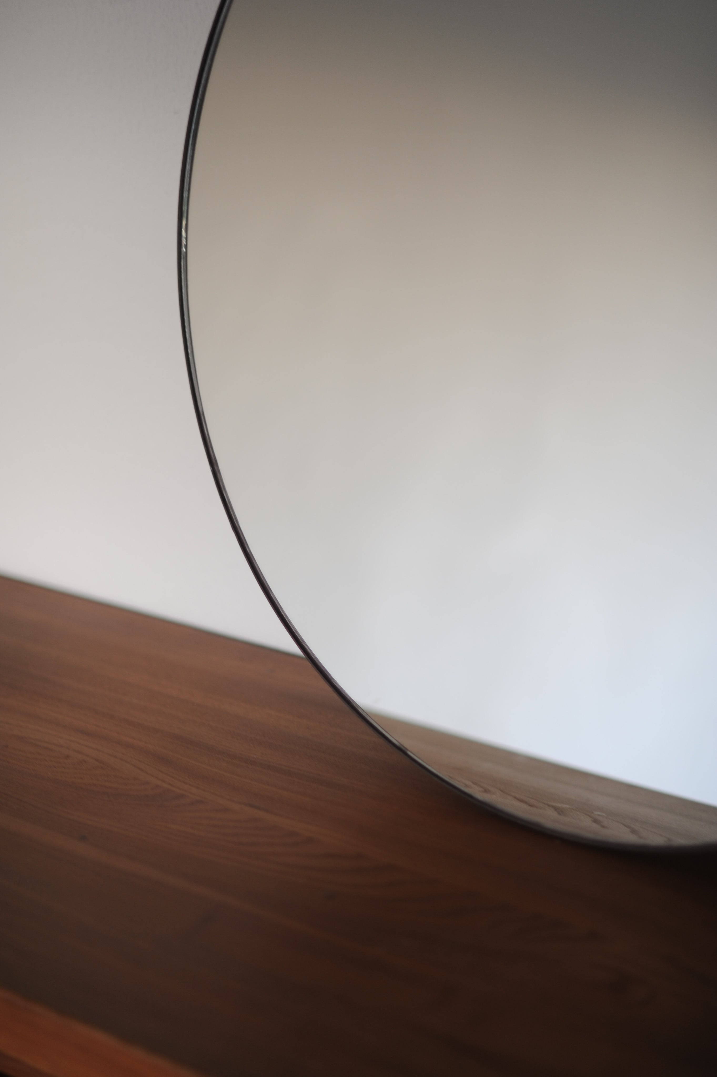 Close-up detail of Italian mid-century circular mirror edge