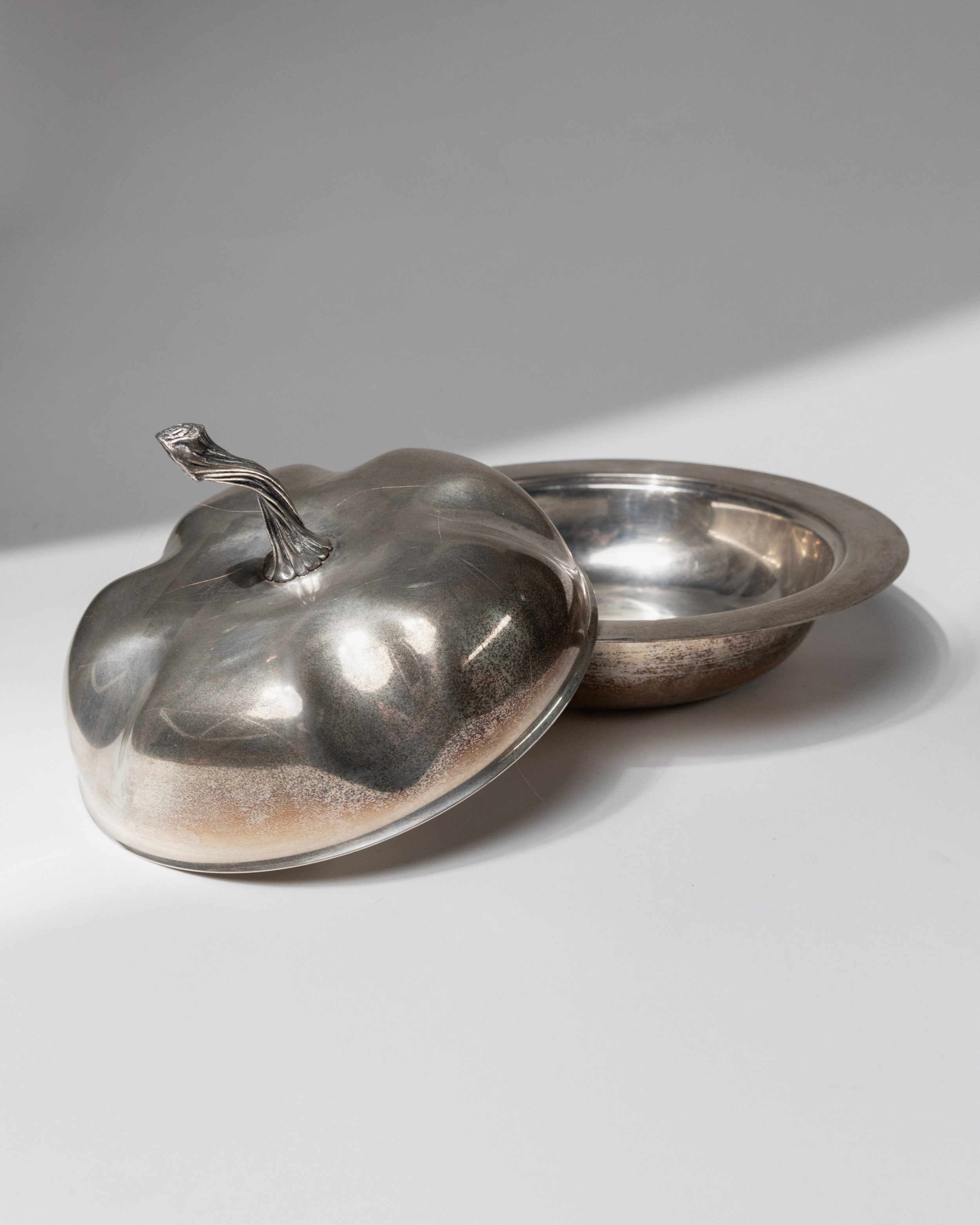 Silver plated serving bowl with domed lid and decorative handle