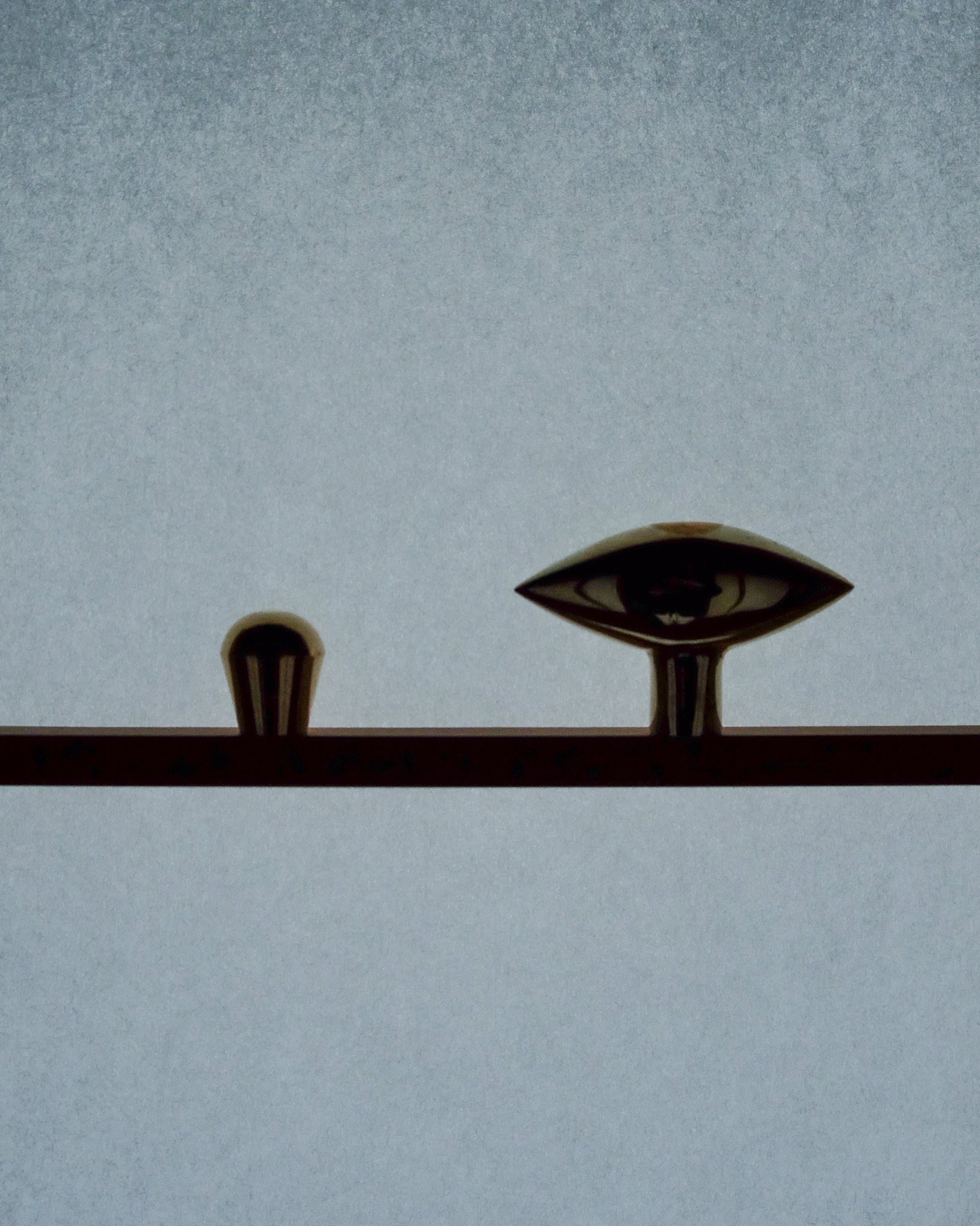 GOOD EYE Cabinet Knob/Wall Hook — side angle showing brass finish and eye design
