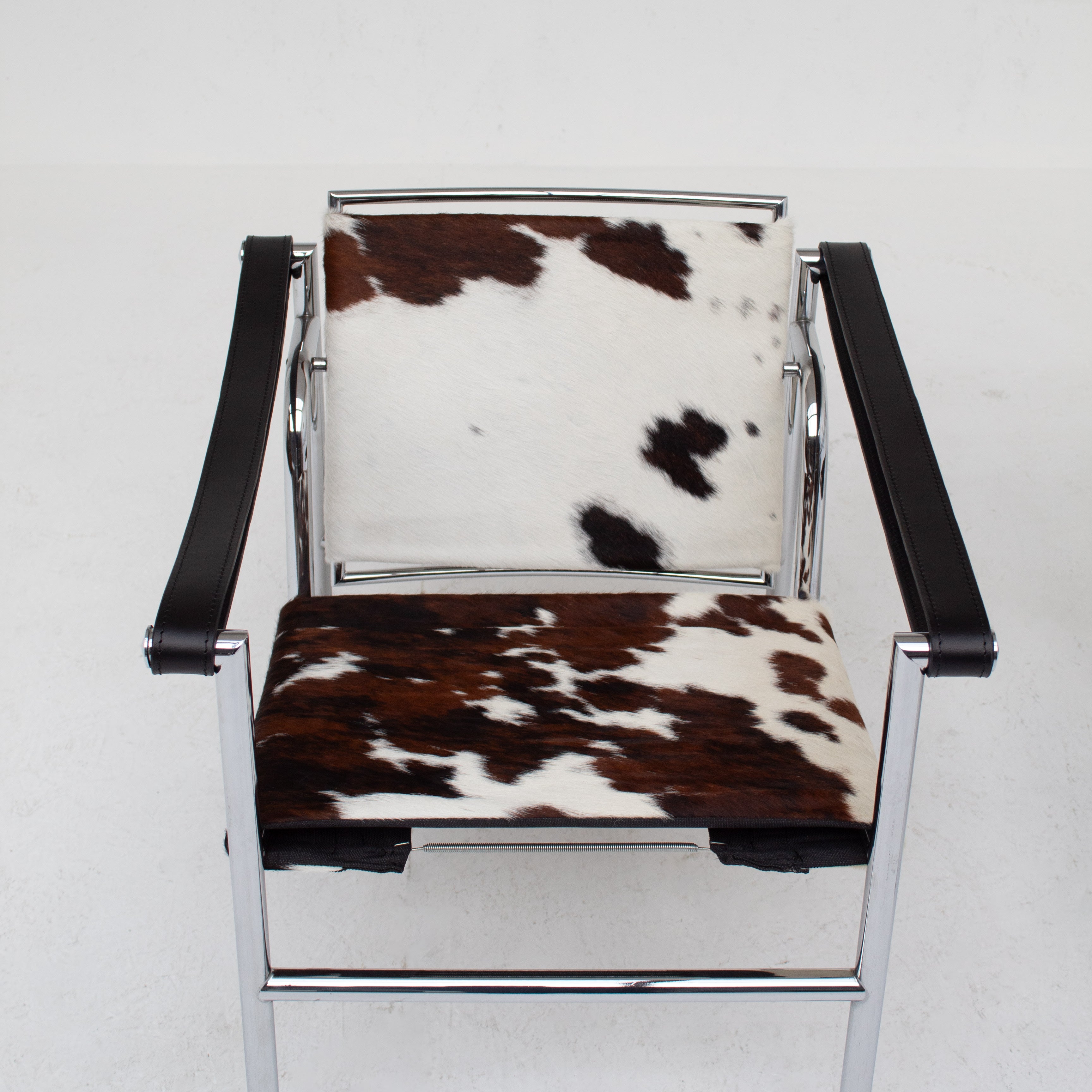 Le Corbusier, Pierre Jeanneret, Charlotte Perriand LC1 Chairs by Cassina | The Oblist — cowhide upholstery, chrome frame