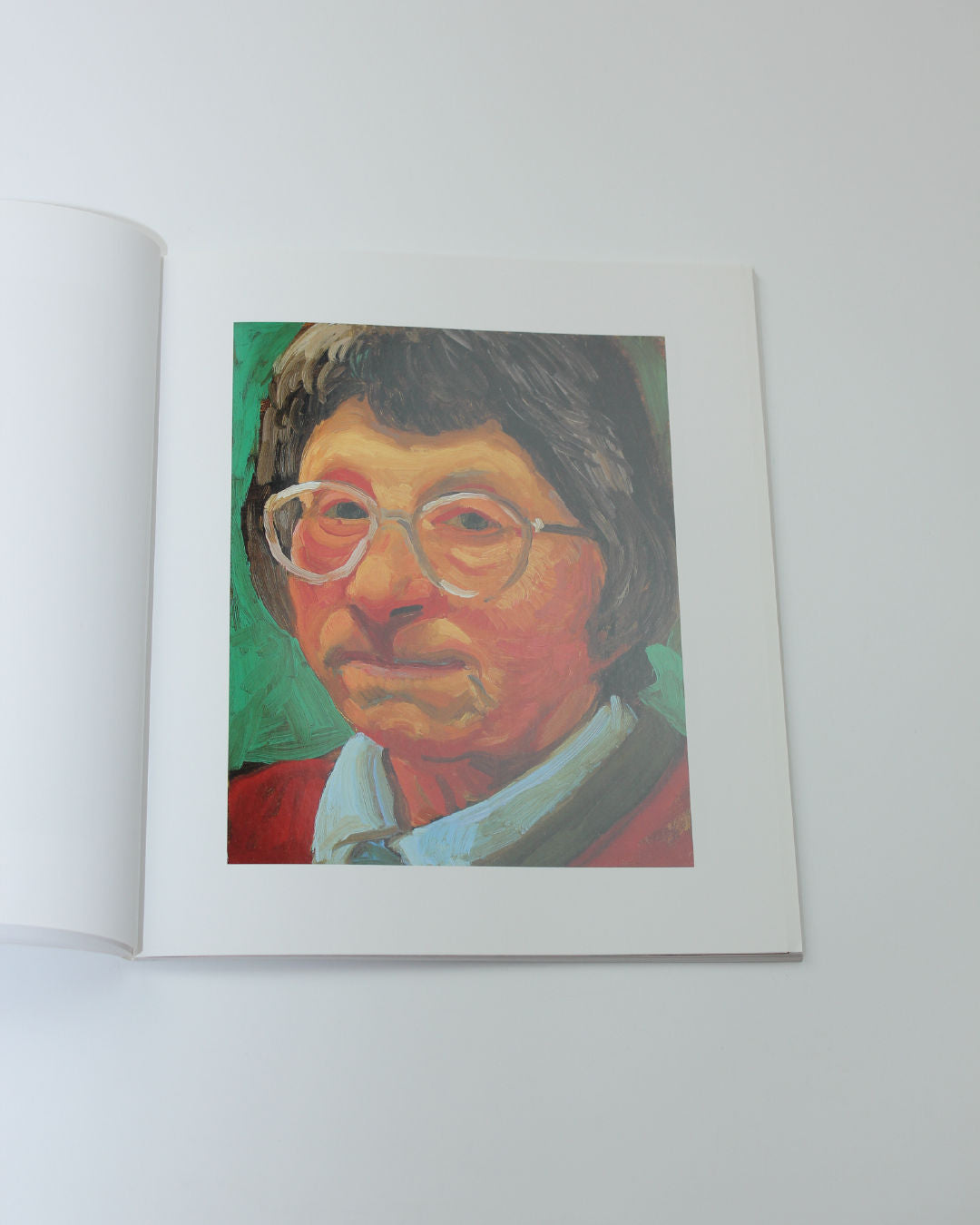 David Hockney: Faces and Spaces Book — top view of open book with portrait illustration