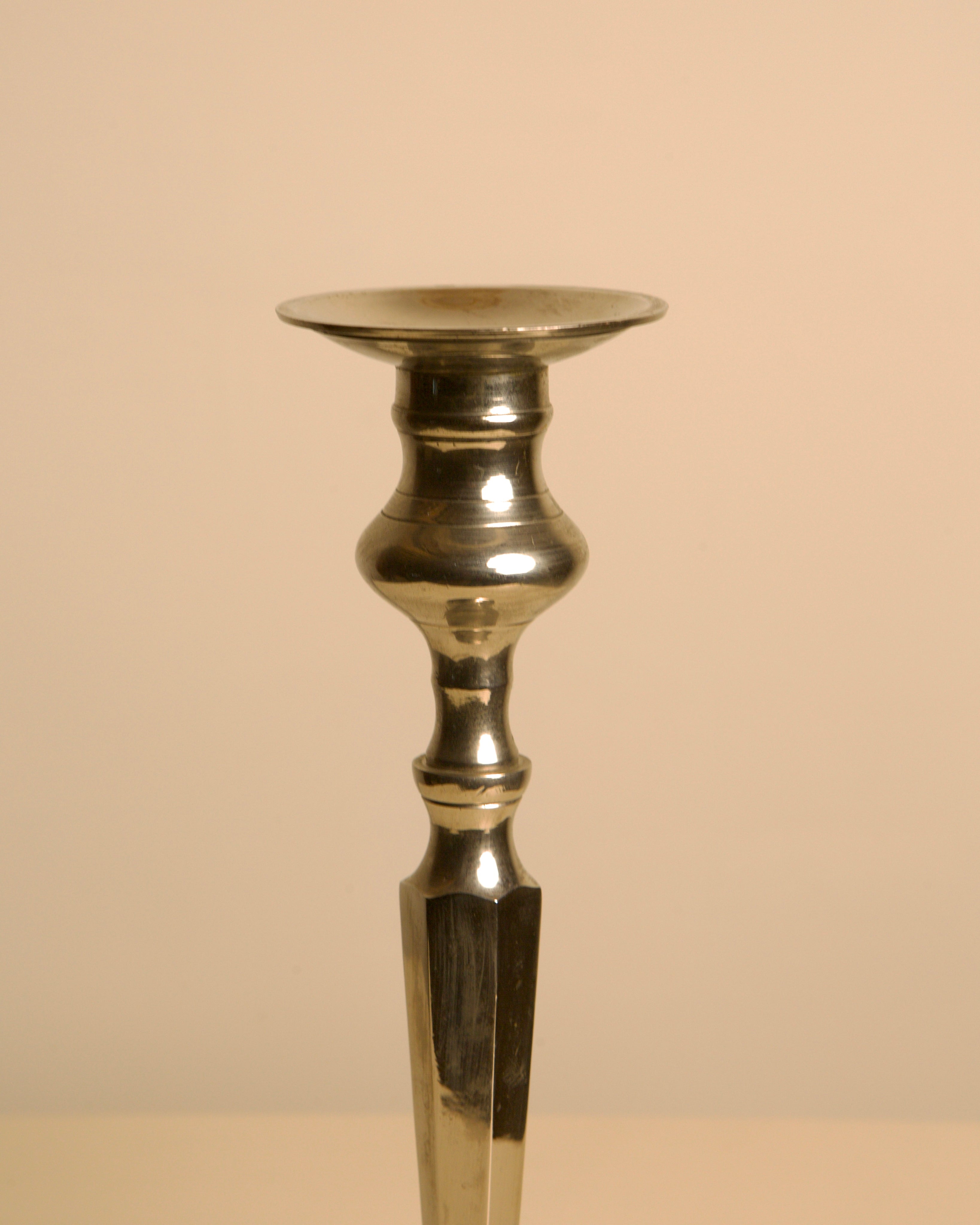 Large Italian "Column" Metal Candleholder, 1960s — side angle highlighting polished metal finish