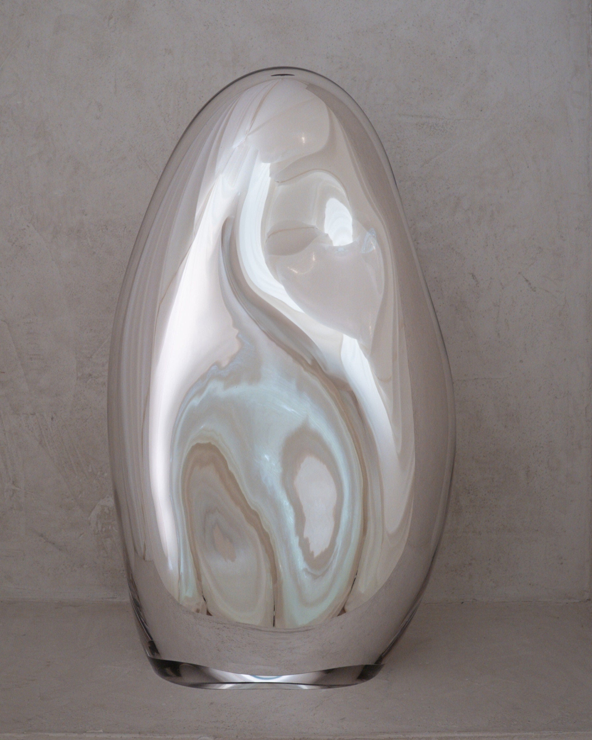 Standing Glass Sculpture - Contemporary Mirror Collection — close-up of reflective glass surface
