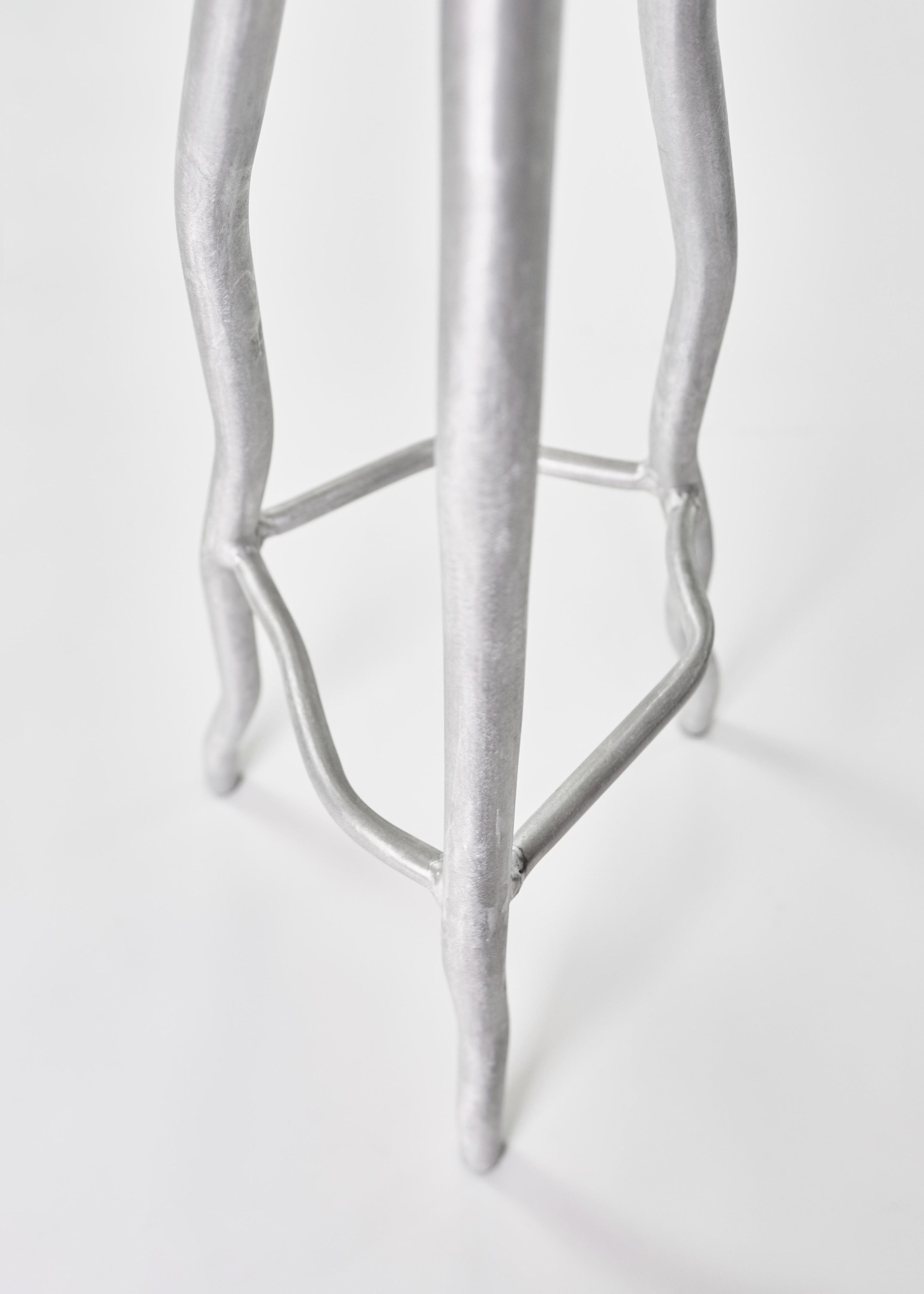 Bar Stool — close-up of silver metal legs
