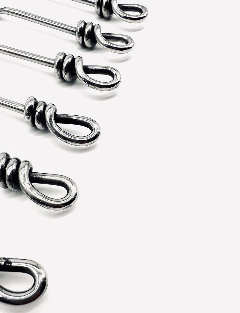 Close-up detail of six vintage moka spoons with stainless steel handles
