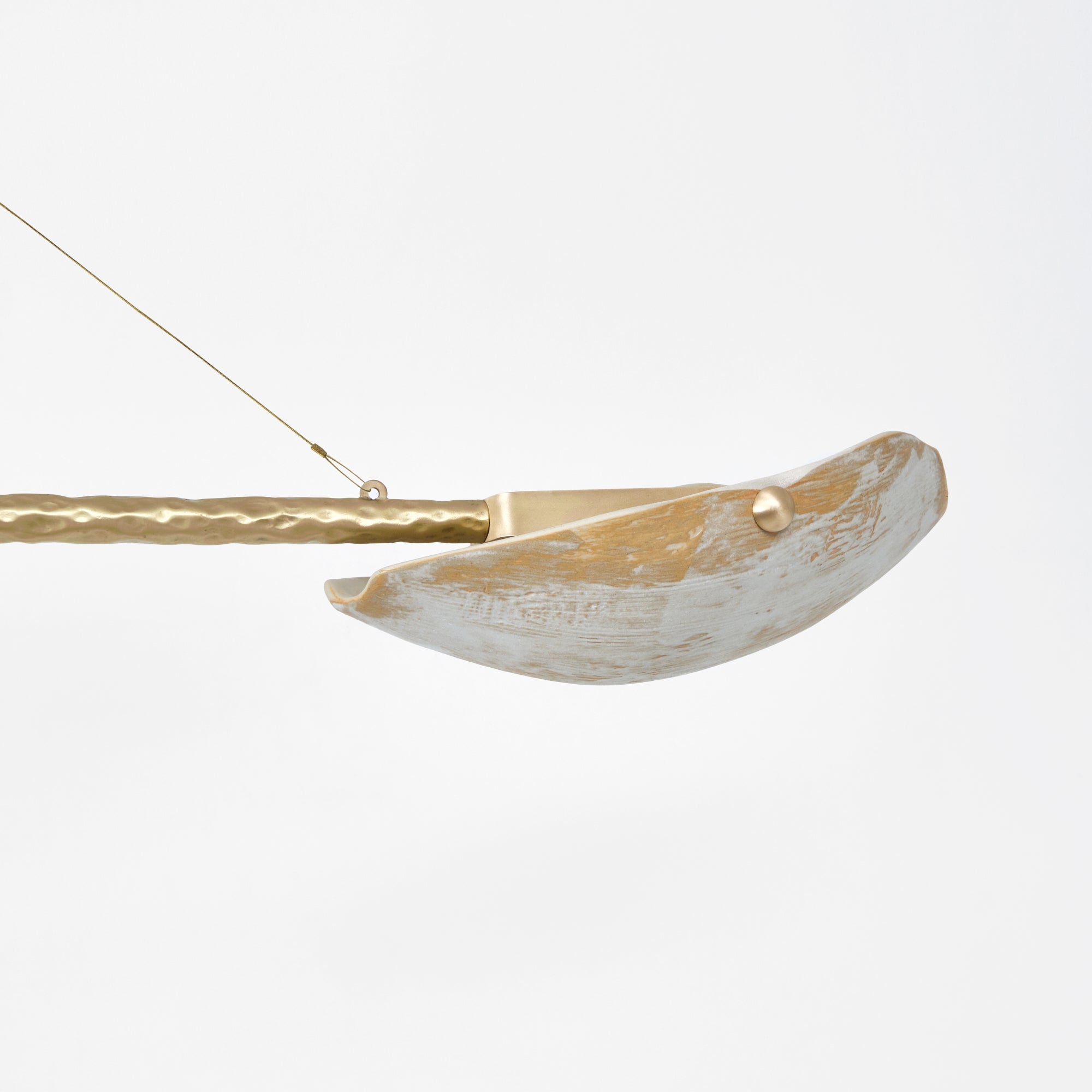 Serrallés Chandelier — side angle showing hammered brass finish