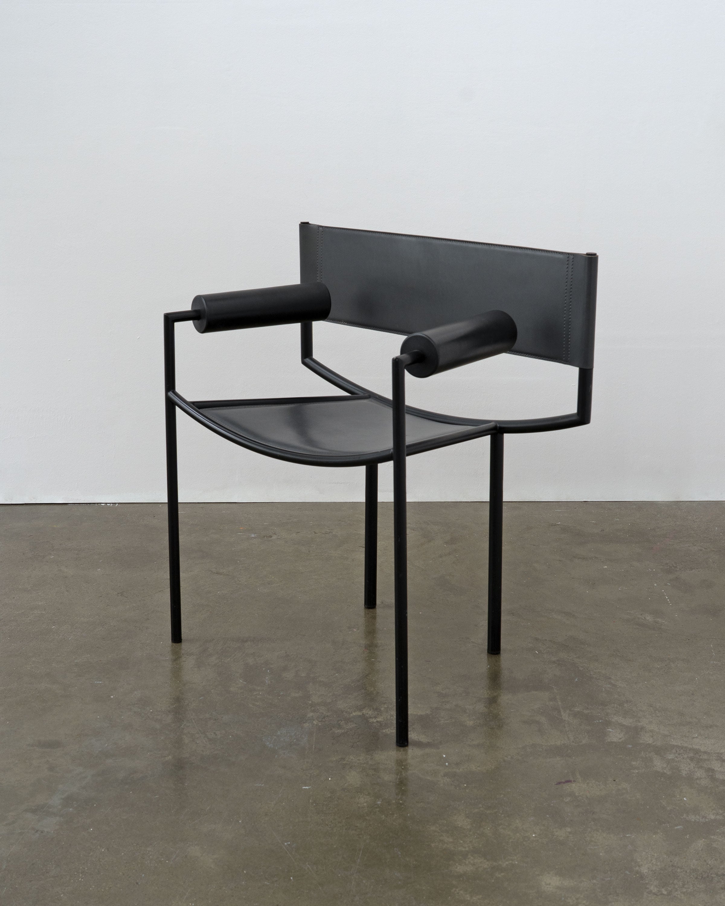Postmodern Leather and Steel Chair, 1980s — close-up of black leather seat and armrests