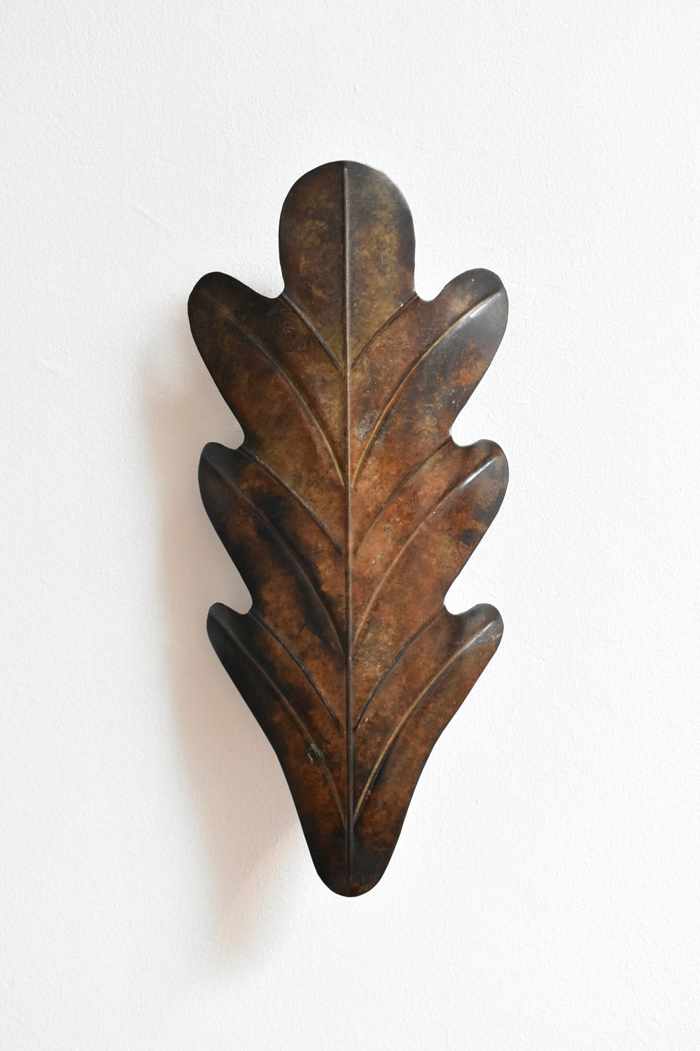 Pair of Painted Metal Acanthus Leaf Wall Sconces, 1970s — close-up of textured brown metal surface