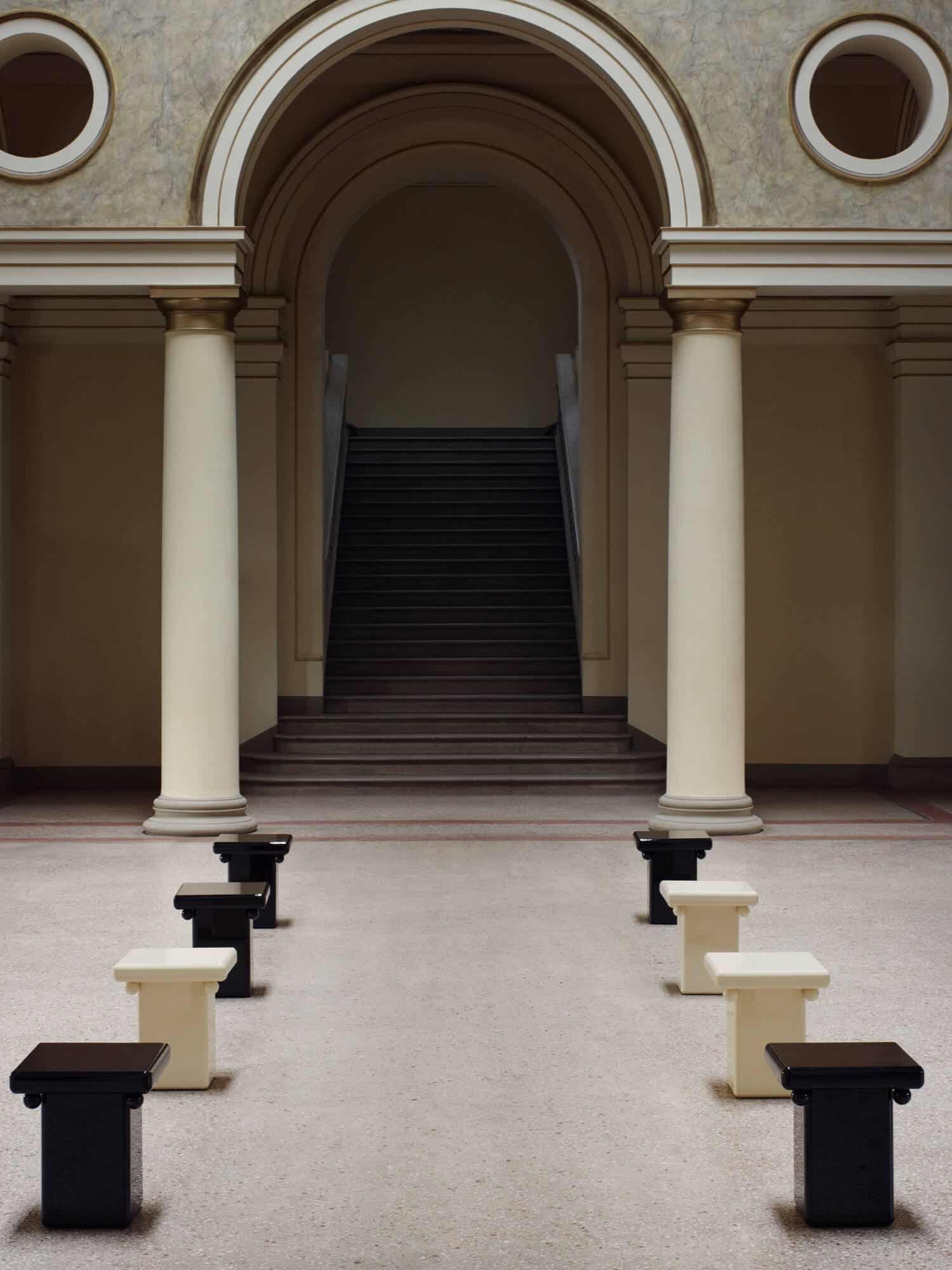 Stool - Cream — side angle in minimalist architectural setting