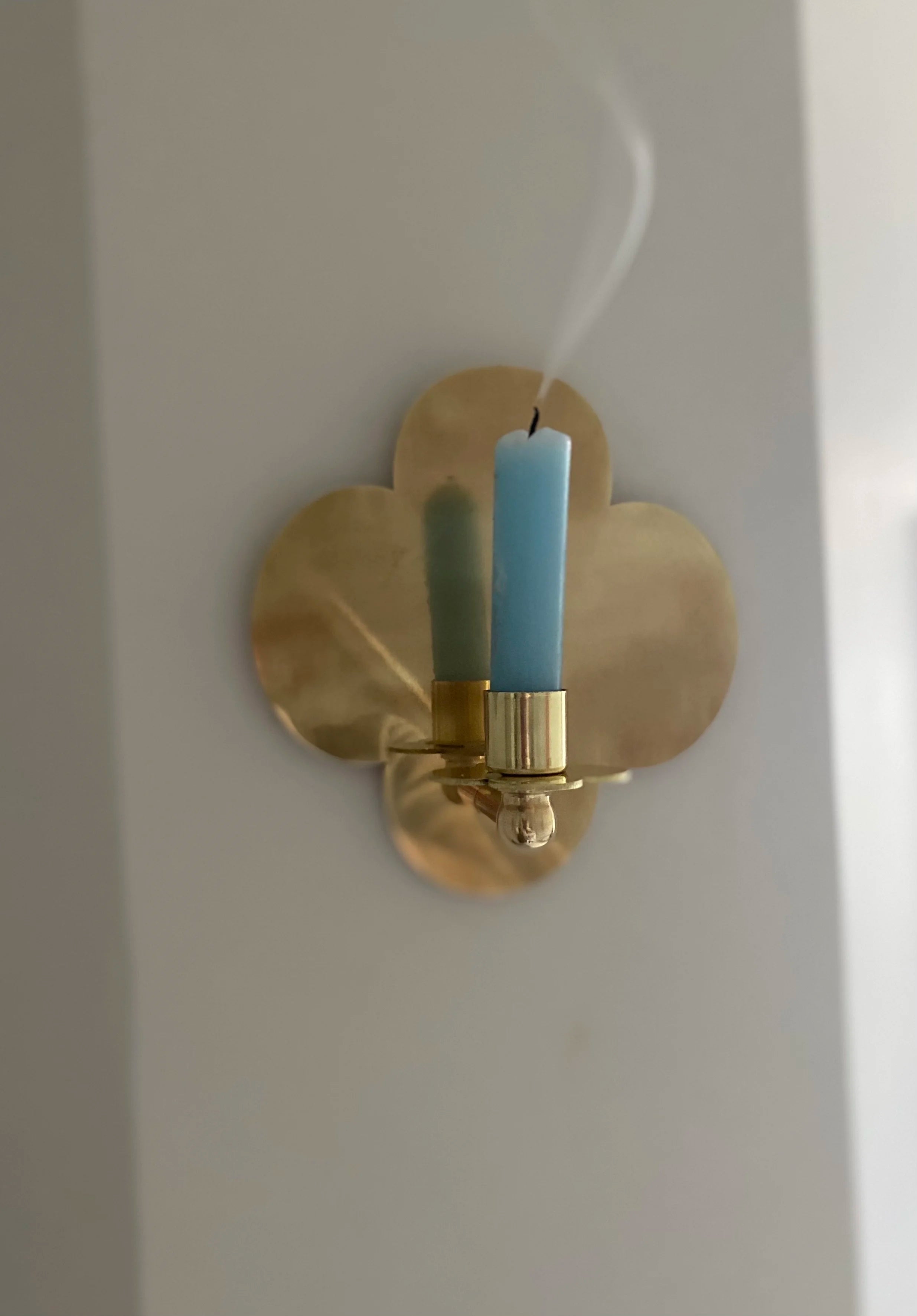 Quatrefoil Candle Sconce D:2023 — angled view on white wall