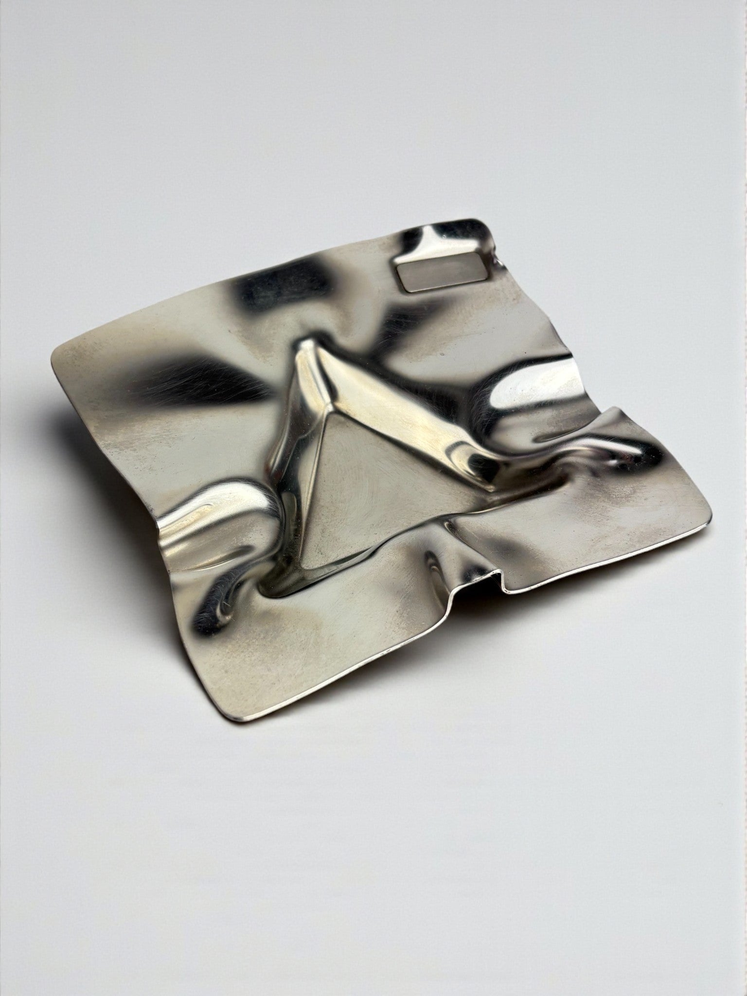 Biomorphic Ashtray, Stainless Steel, Spain, 1970s — close-up of reflective surface detail