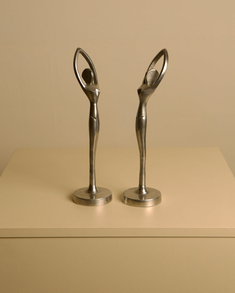 Pair of Italian aluminum dancers from the 80s by Treaptyque | The Oblist — vintage aluminum sculptures