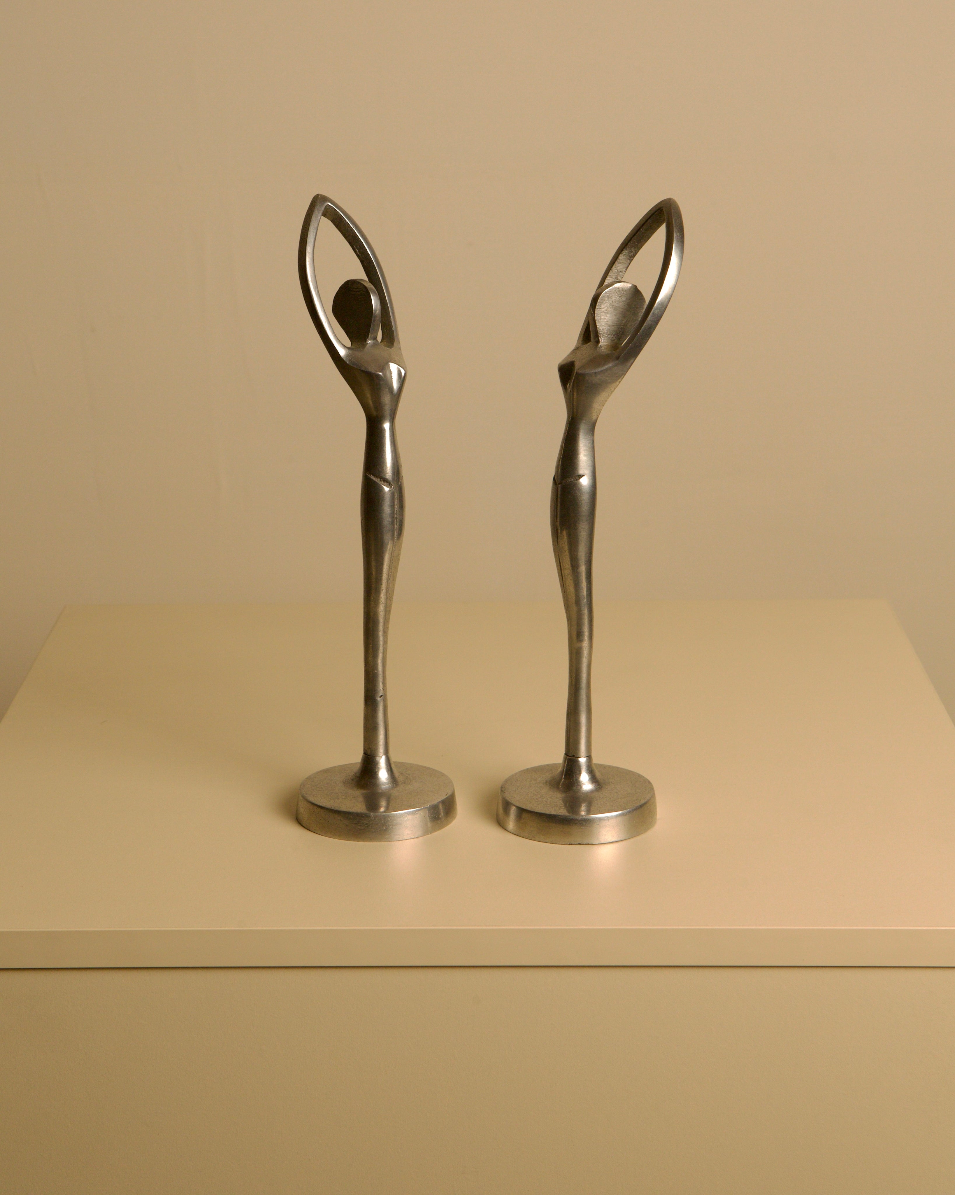 Pair of Italian aluminum dancers from the 80s by Treaptyque | The Oblist — vintage aluminum sculptures
