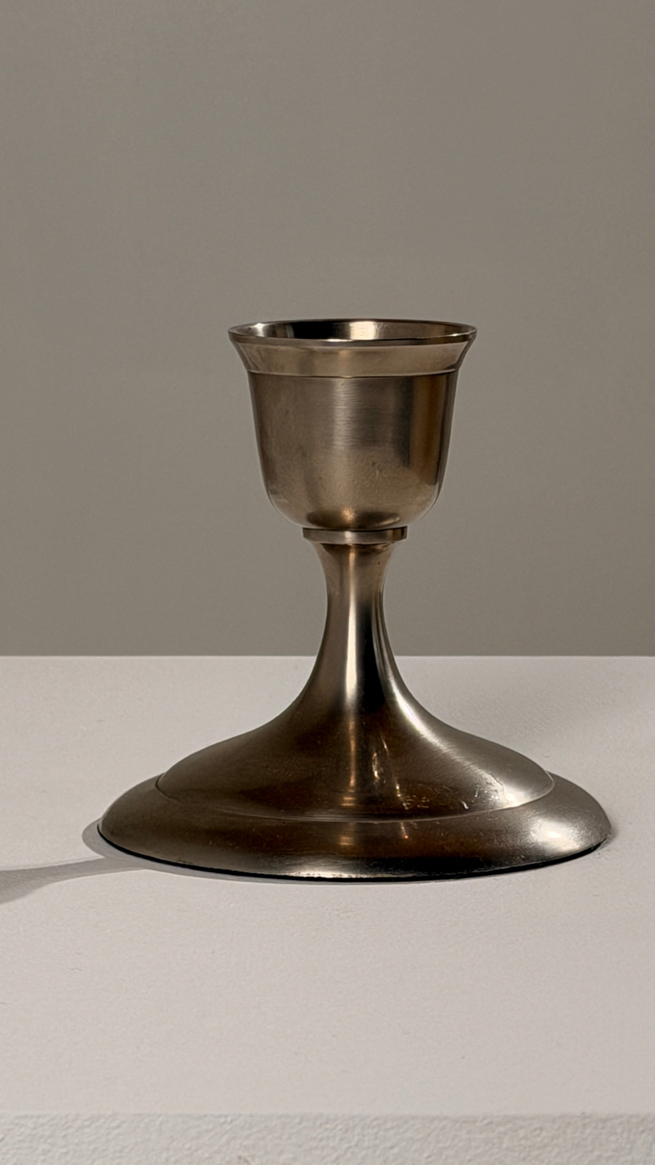 Silver-plated Metal Candleholders, France, circa 1930 — close-up of polished metal surface