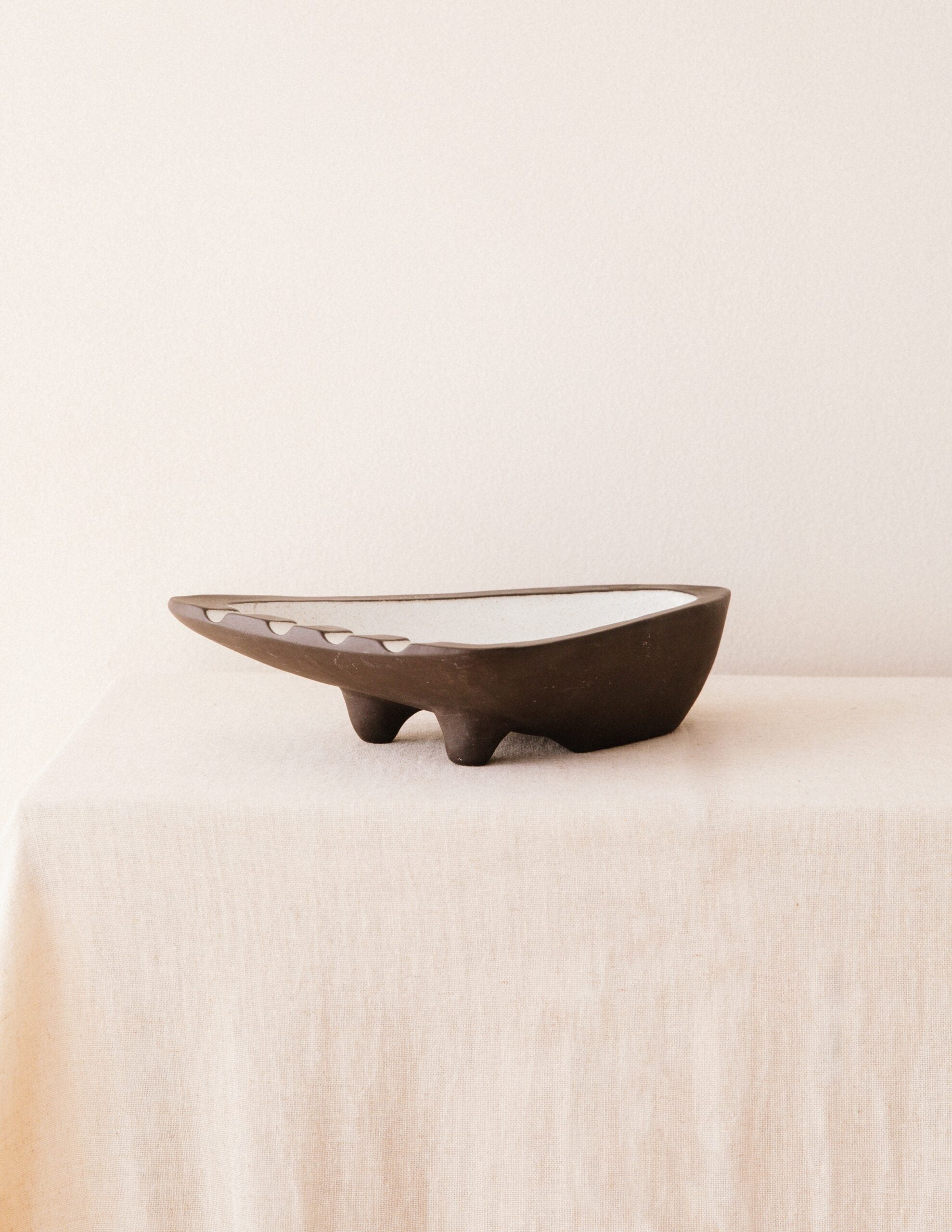 Jaap Ravelli “Black & White” Ashtray — side angle on neutral fabric background