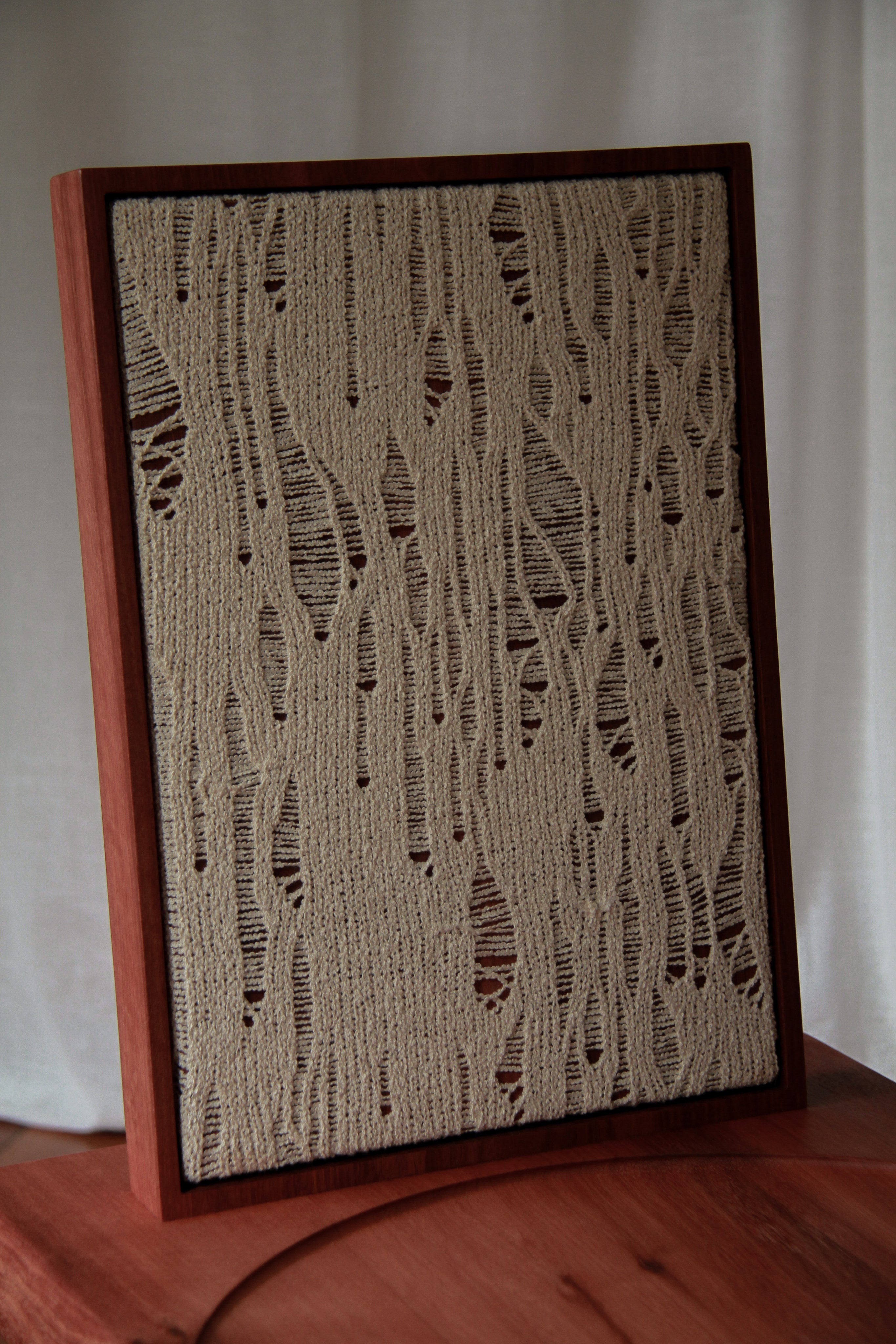 Waiting Chair — close-up of textured fabric on wooden frame