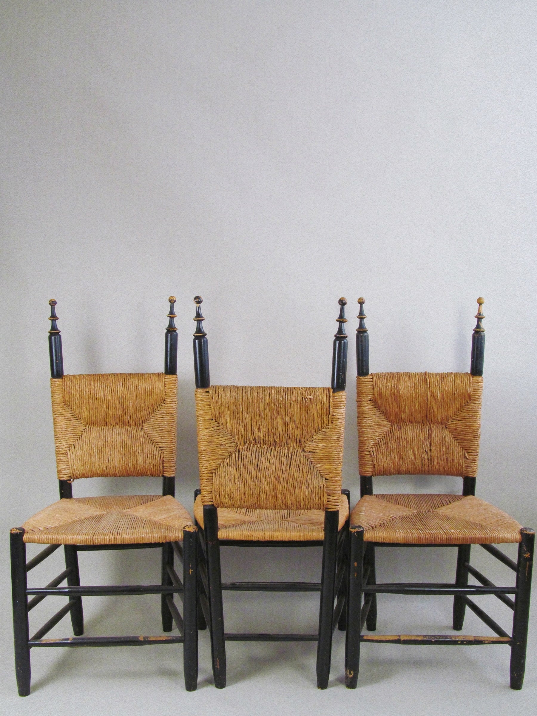 Set of Four European Rush-Back Chairs c.1950. — front view highlighting woven rush seats