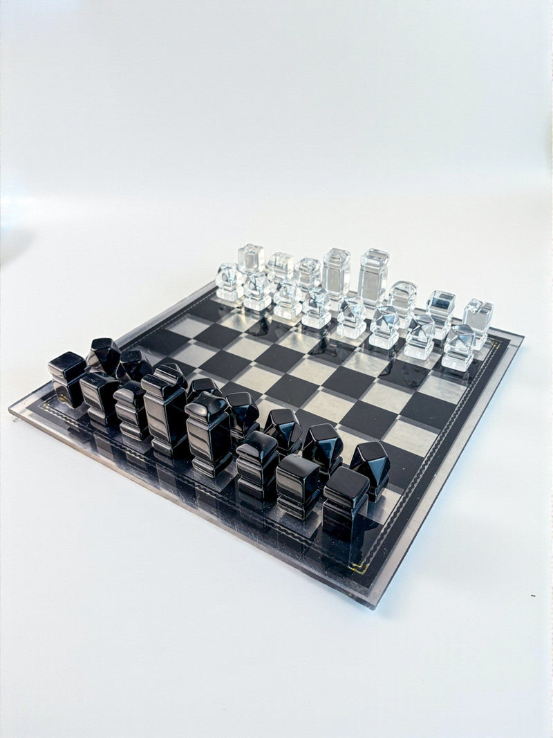 Felice Antonio Botta Acrylic Chessboard, Italy, 70s — angled view of black and clear acrylic pieces