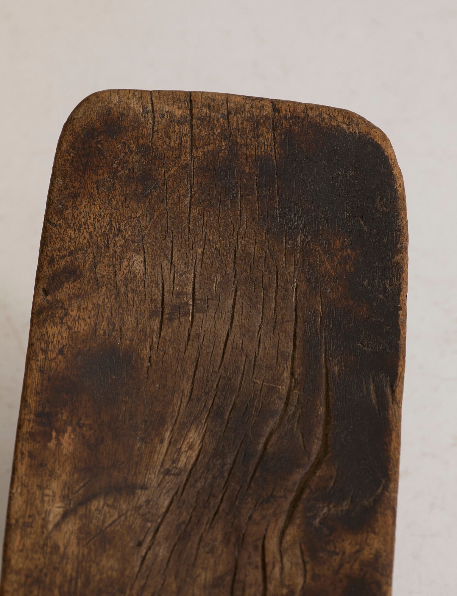 West African Monoxyle Stool in Dark Patinated Wood — close-up