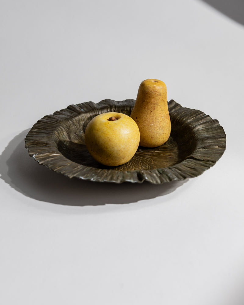 Styling detail of 1960s brass decorative bowl with fruit display