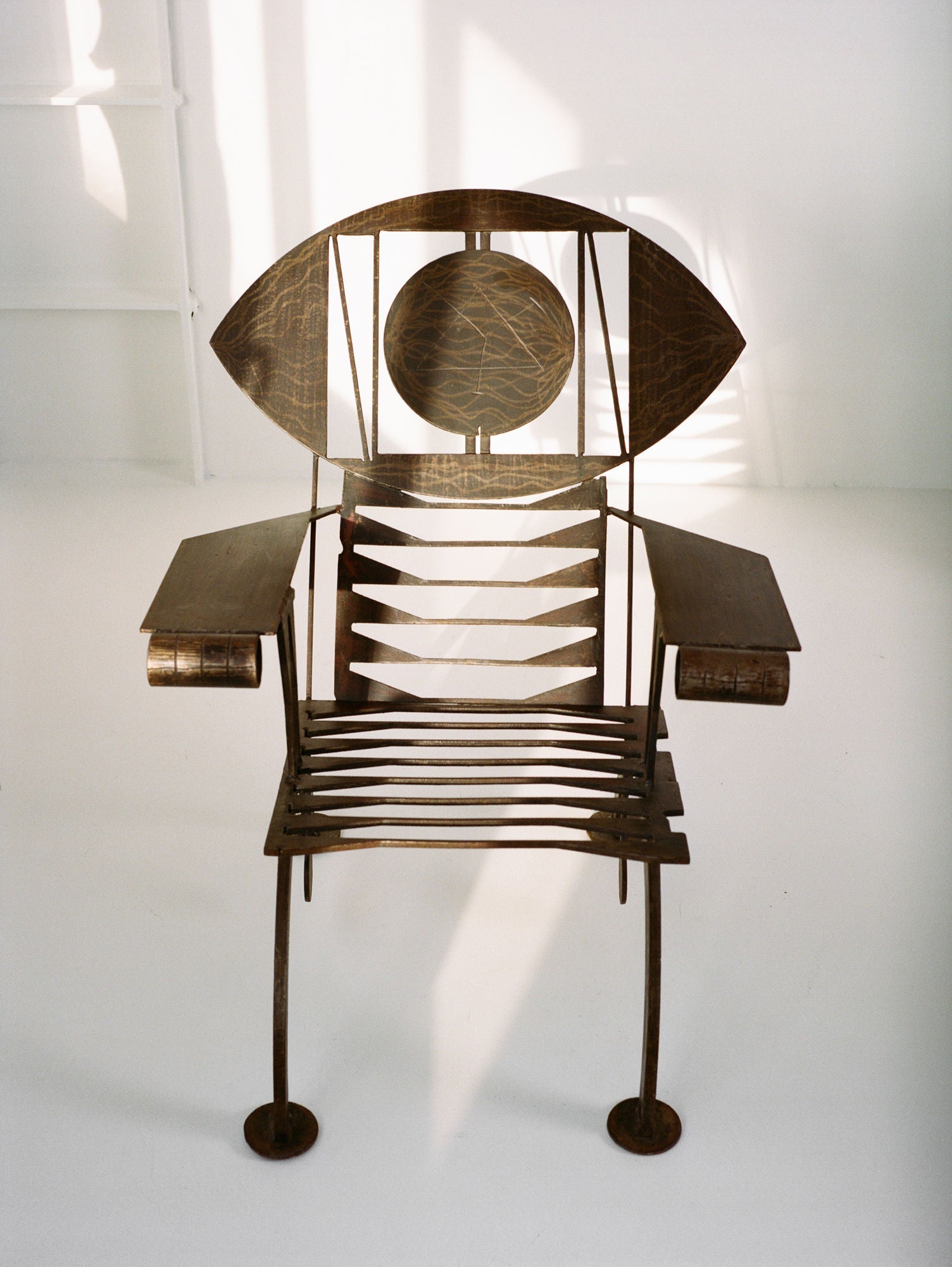 Functional Sculpture / Vintage Artist Arm Chair from Nigeria C. 1960-70 — back view highlighting metal frame and eye design