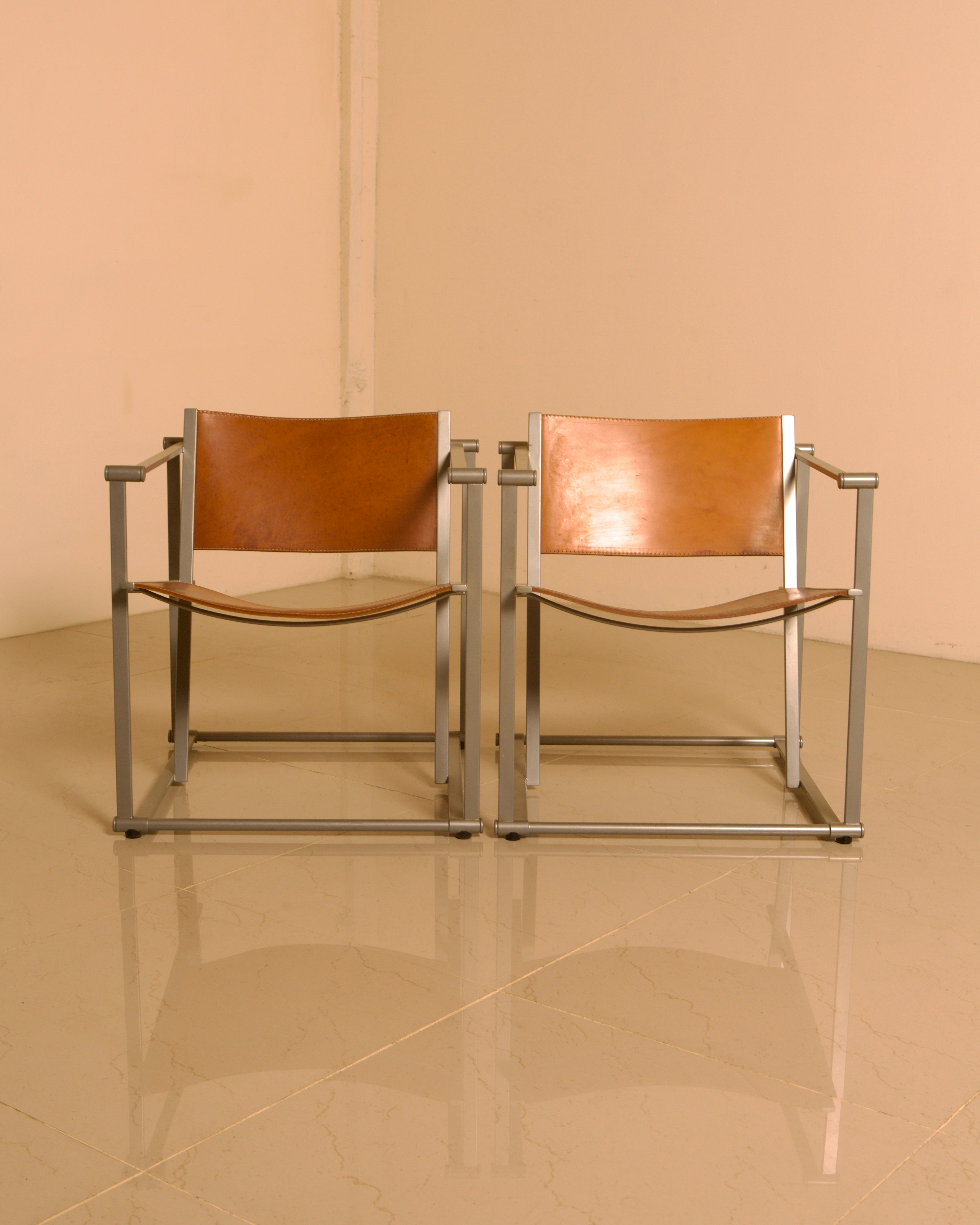Pair of "FM62" Armchairs by Radboud van Beekum for Pastoe, 1980s — top view of brown leather seats on metal frames
