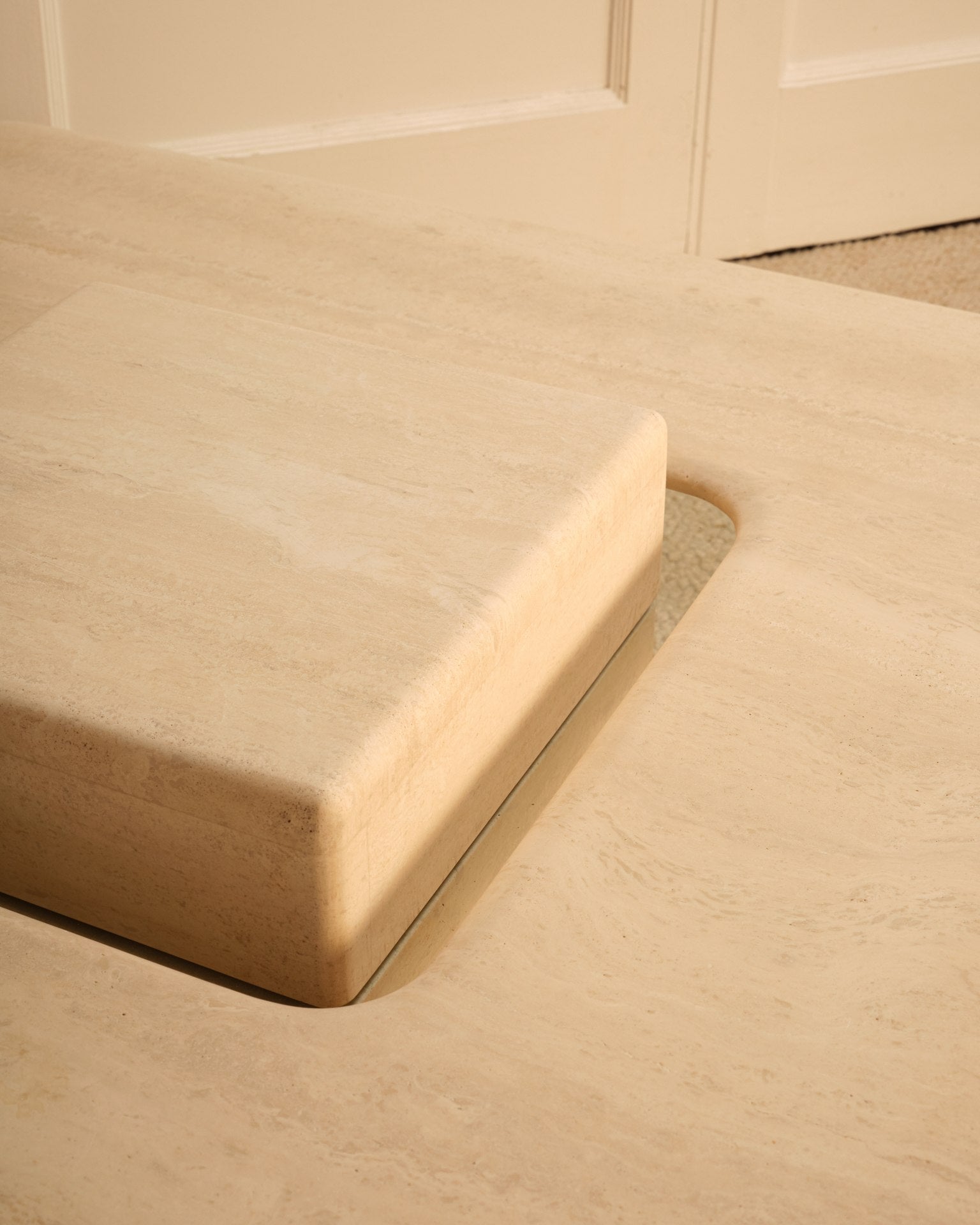 Saturn travertine coffee table curved corner detail view