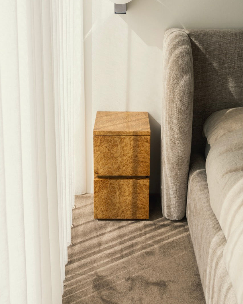 Bohult Due' Bedside Table — side angle showing warm wood finish in bedroom