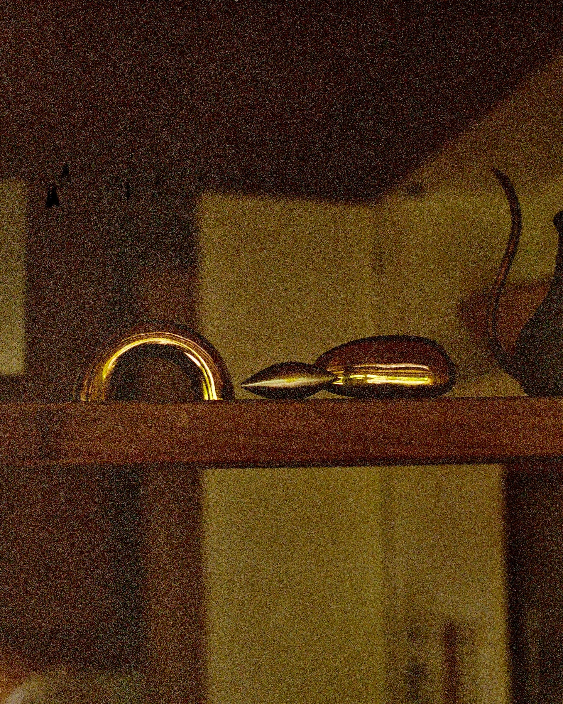 GOOD EYE Cabinet Knob/Wall Hook — close-up of brass knob on wooden shelf