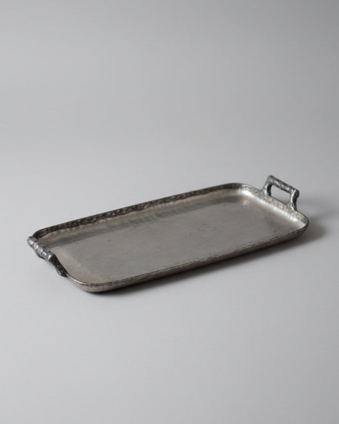 Brutalist Tray — close-up of textured metal surface