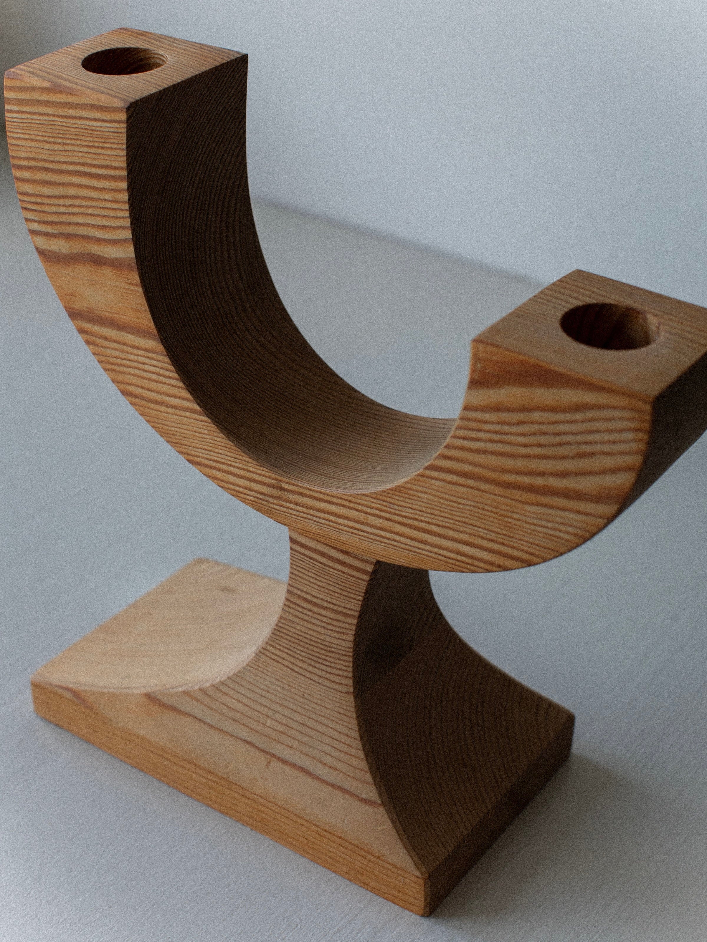 Out For Lunch Wooden Candleholder: a vintage U-shaped design with two candle holes on a rectangular base, shown on a light surface—ideal as unique pre-loved decor.