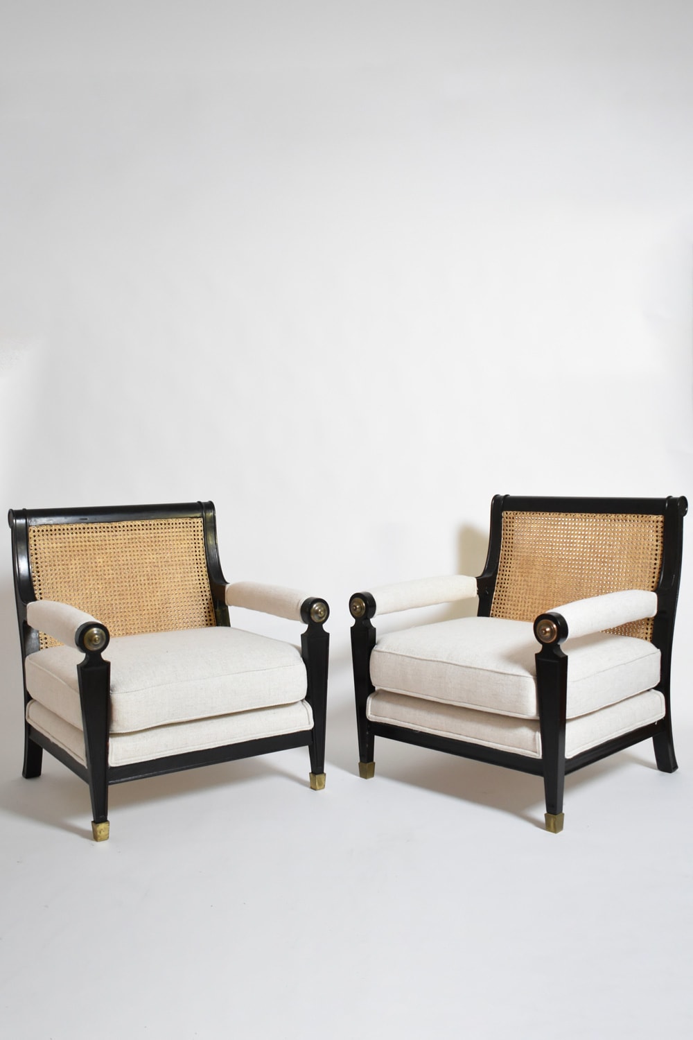Pair of neoclassical ebonised wood and caning armchairs, 1960s — top view showing caned backs and upholstered seats