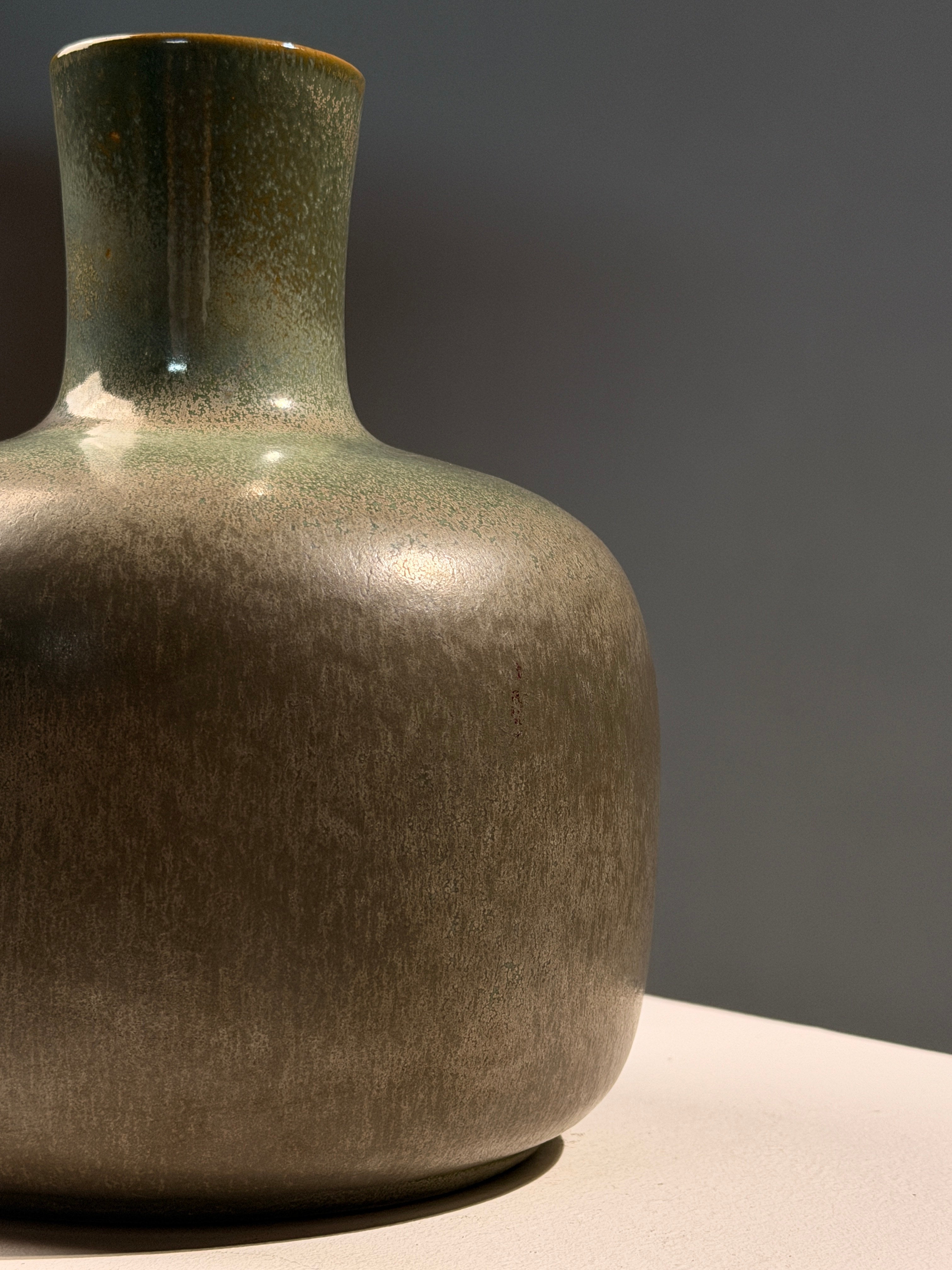 Speckled green glazed earthenware bottle vase, circa 1970 — close-up