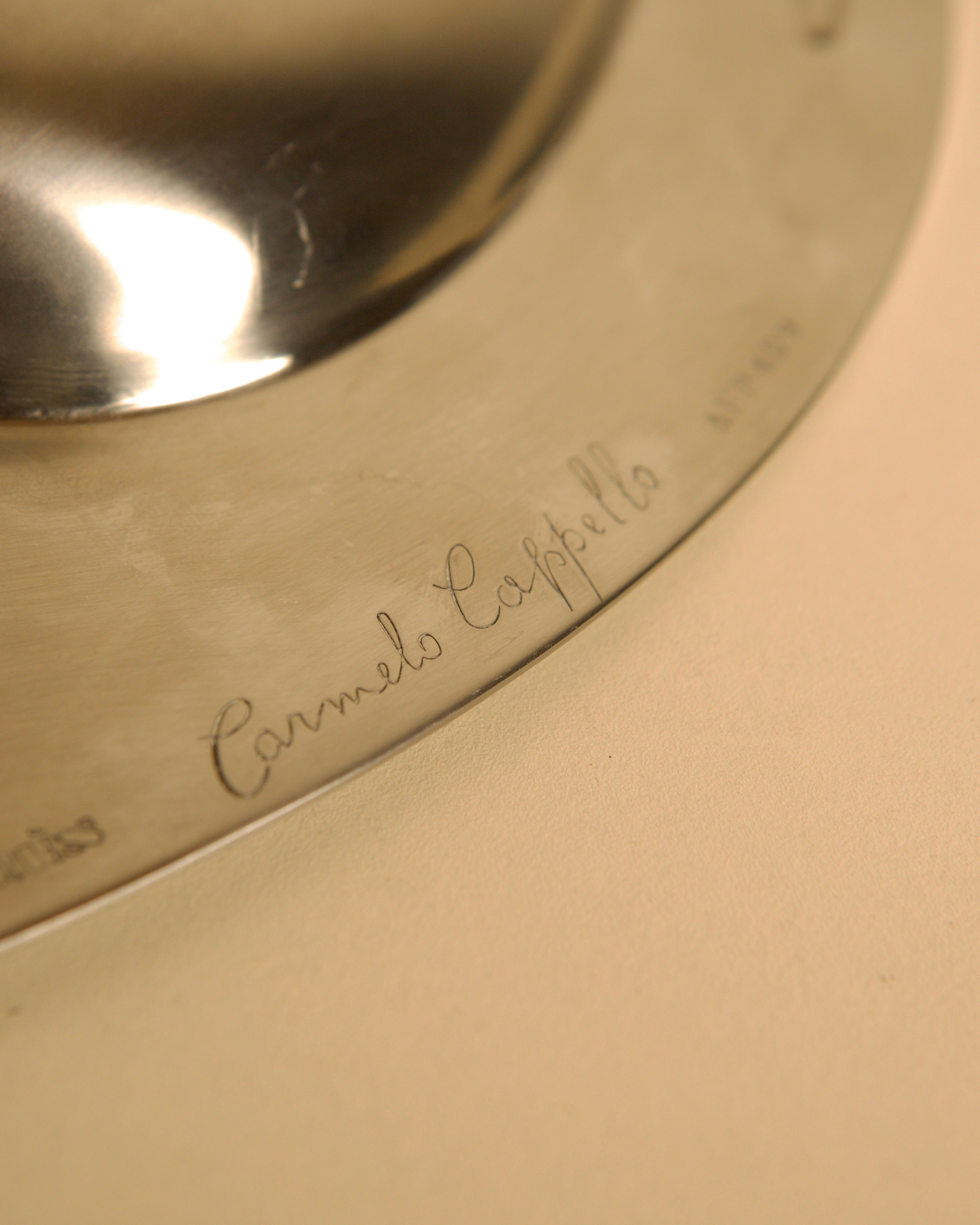 Large metal storage compartment 'Forma Orizzontale Circolare' by Carmelo Cappello — back view highlighting engraved signature