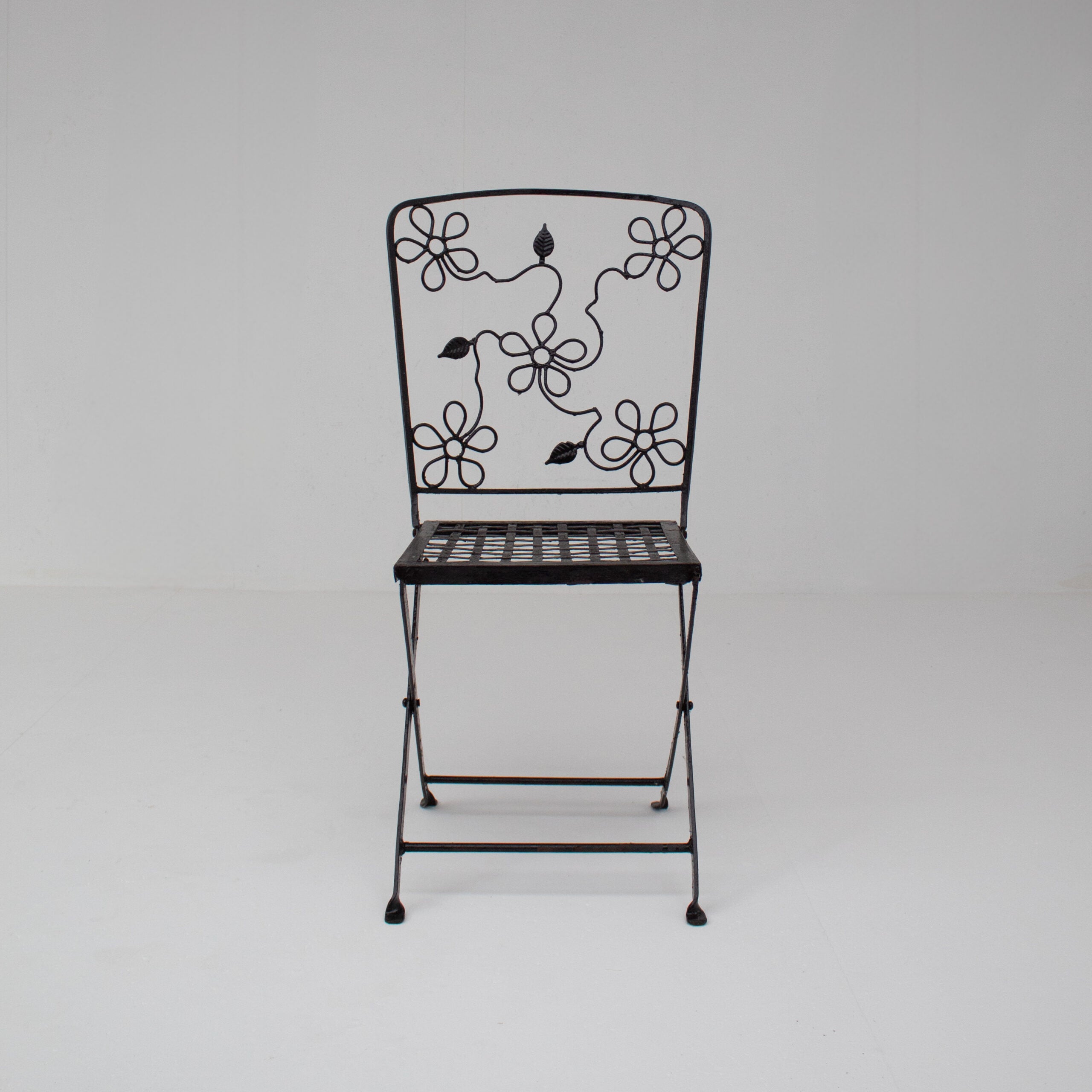 Set of Three Decorative Wrought Iron Garden Chairs with Floral Backrests — in context